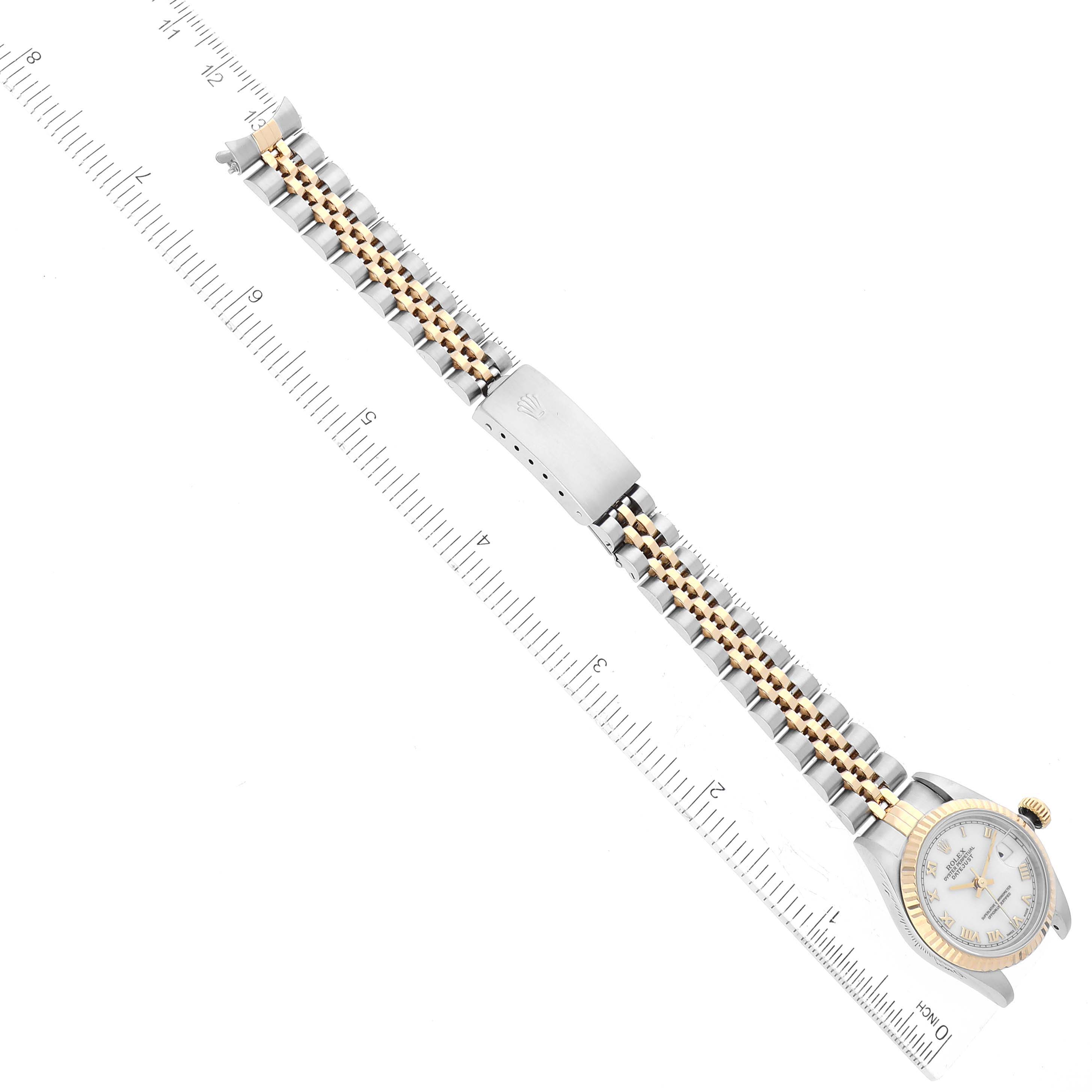 The image shows a Rolex Datejust 69173 Women's Steel and Gold (two tone) White Dial 69173 Women's Steel and Gold (two tone) White Dial watch from an overhead angle, focusing on the watch's band and part of the face.