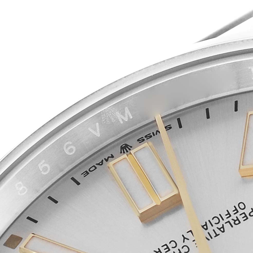 This image shows a close-up of the dial and part of the bezel of a Rolex Oyster Perpetual 124300 Men's Stainless Steel Silver Dial 124300 Men's Stainless Steel Silver Dial watch, highlighting its markers and text.