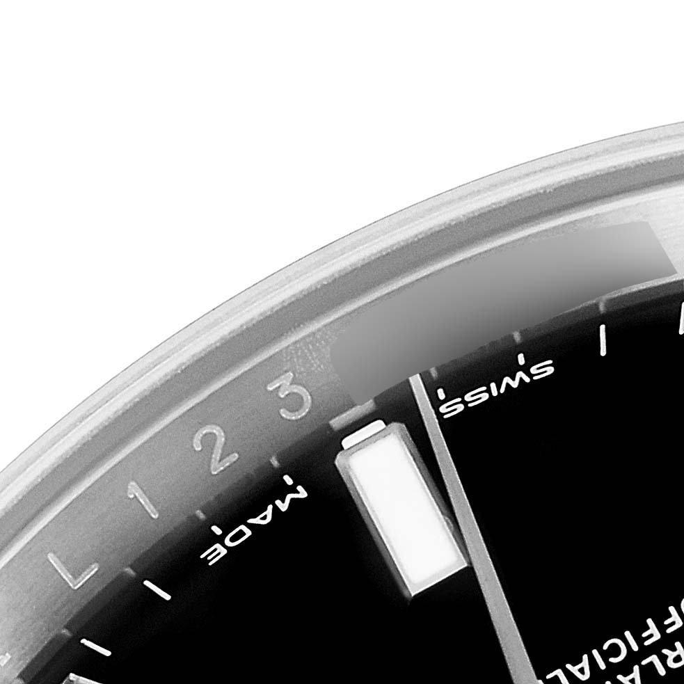 This image shows a close-up of the dial of a Rolex Oyster Perpetual 114200 Men's Stainless Steel Black Dial 114200 Men's Stainless Steel Black Dial watch, displaying the "Swiss Made" text and part of the chapter ring.