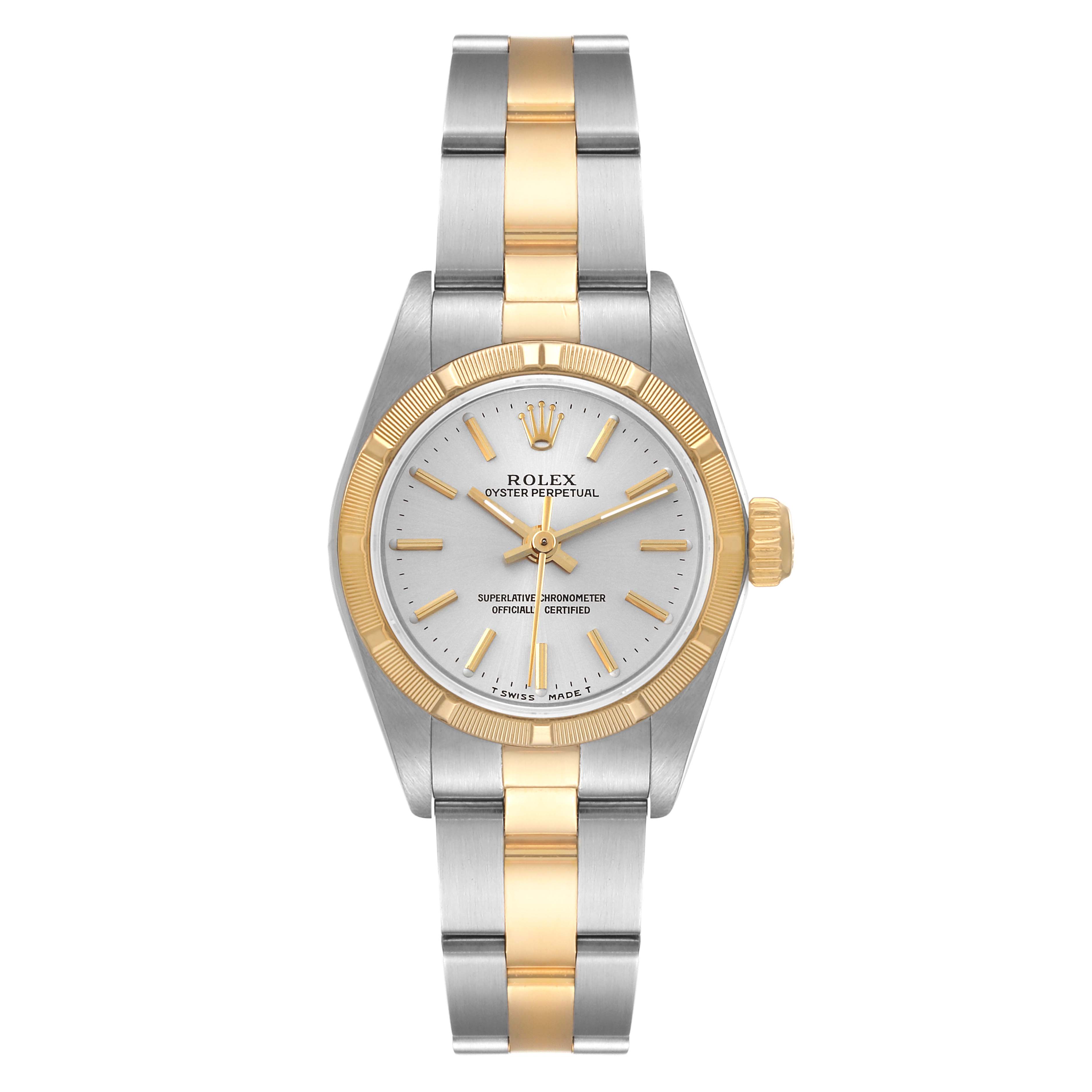 The image shows a top view of a Rolex Oyster Perpetual 67233 Women's Steel and Gold (two tone) Silver Dial 67233 Women's Steel and Gold (two tone) Silver Dial, highlighting its face, bezel, and bi-tone bracelet.