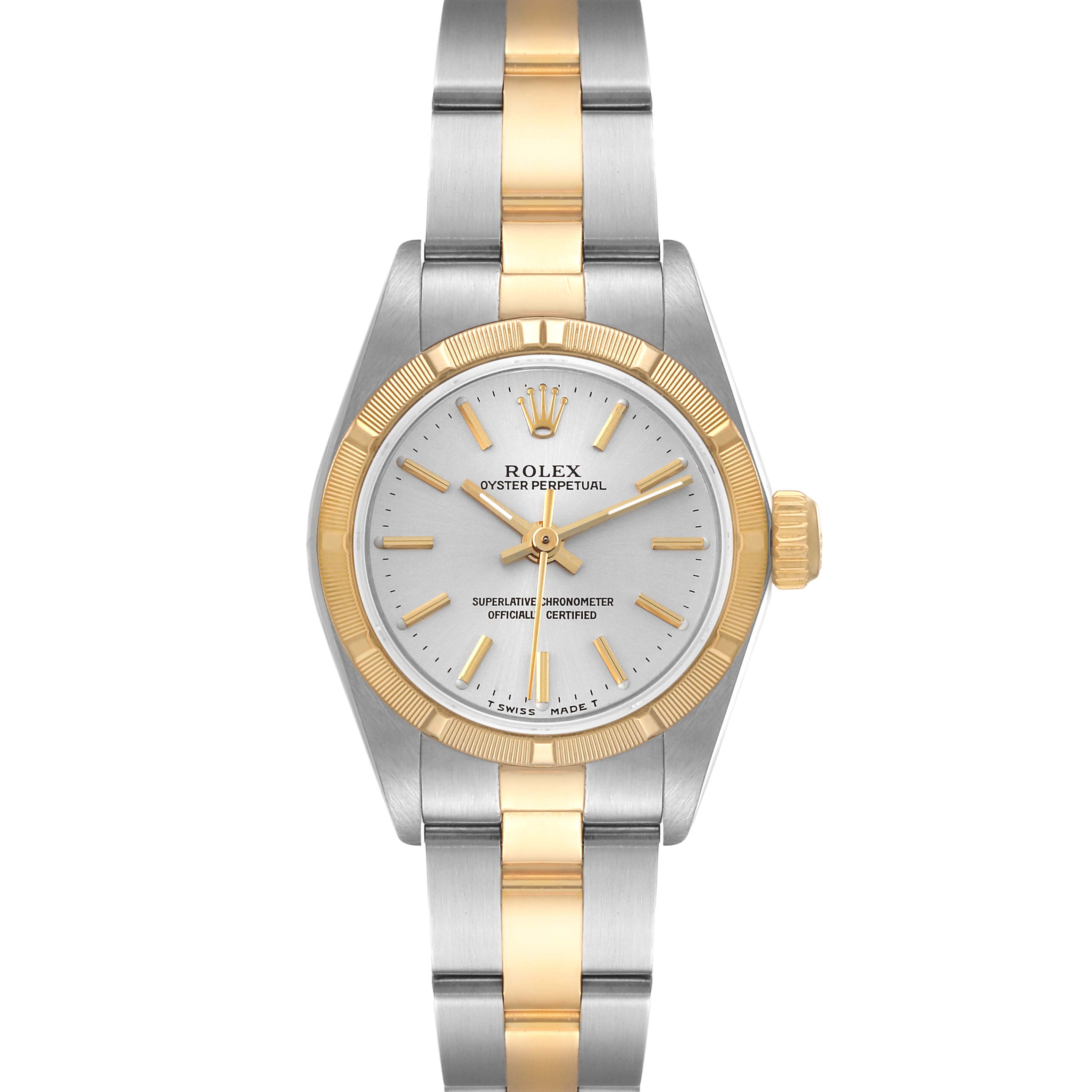This image showcases a Rolex Oyster Perpetual 67233 Women's Steel and Gold (two tone) Silver Dial 67233 Women's Steel and Gold (two tone) Silver Dial watch from a front angle, highlighting the dial, bezel, and bracelet.