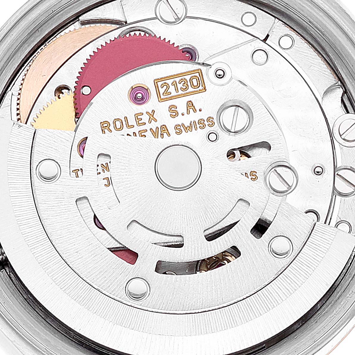 The image shows a close-up of the internal mechanical movement of a Rolex Oyster Perpetual 67233 Women's Steel and Gold (two tone) Silver Dial 67233 Women's Steel and Gold (two tone) Silver Dial watch.