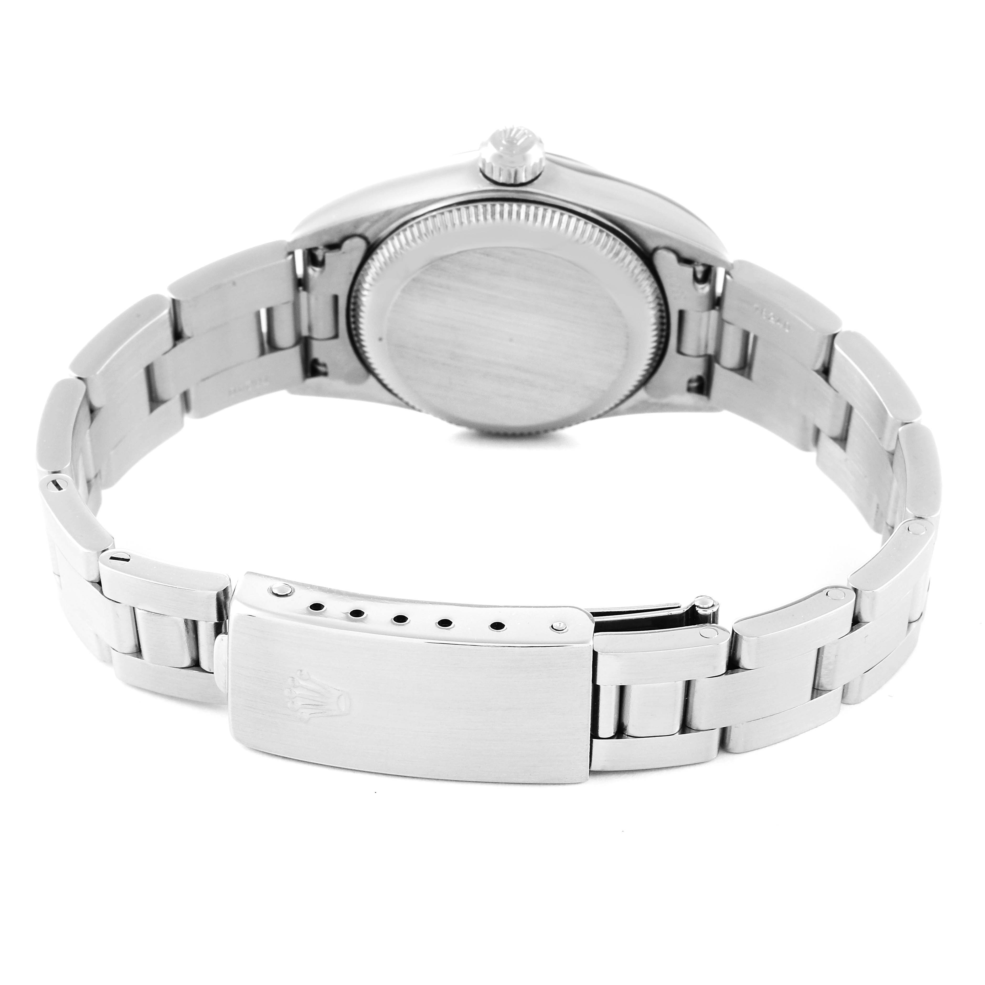 This image shows the back and clasp of a Rolex Oyster Perpetual 76080 Women
s Stainless Steel Pink Dial 76080 Women
s Stainless Steel Pink Dial watch from a rear angle.