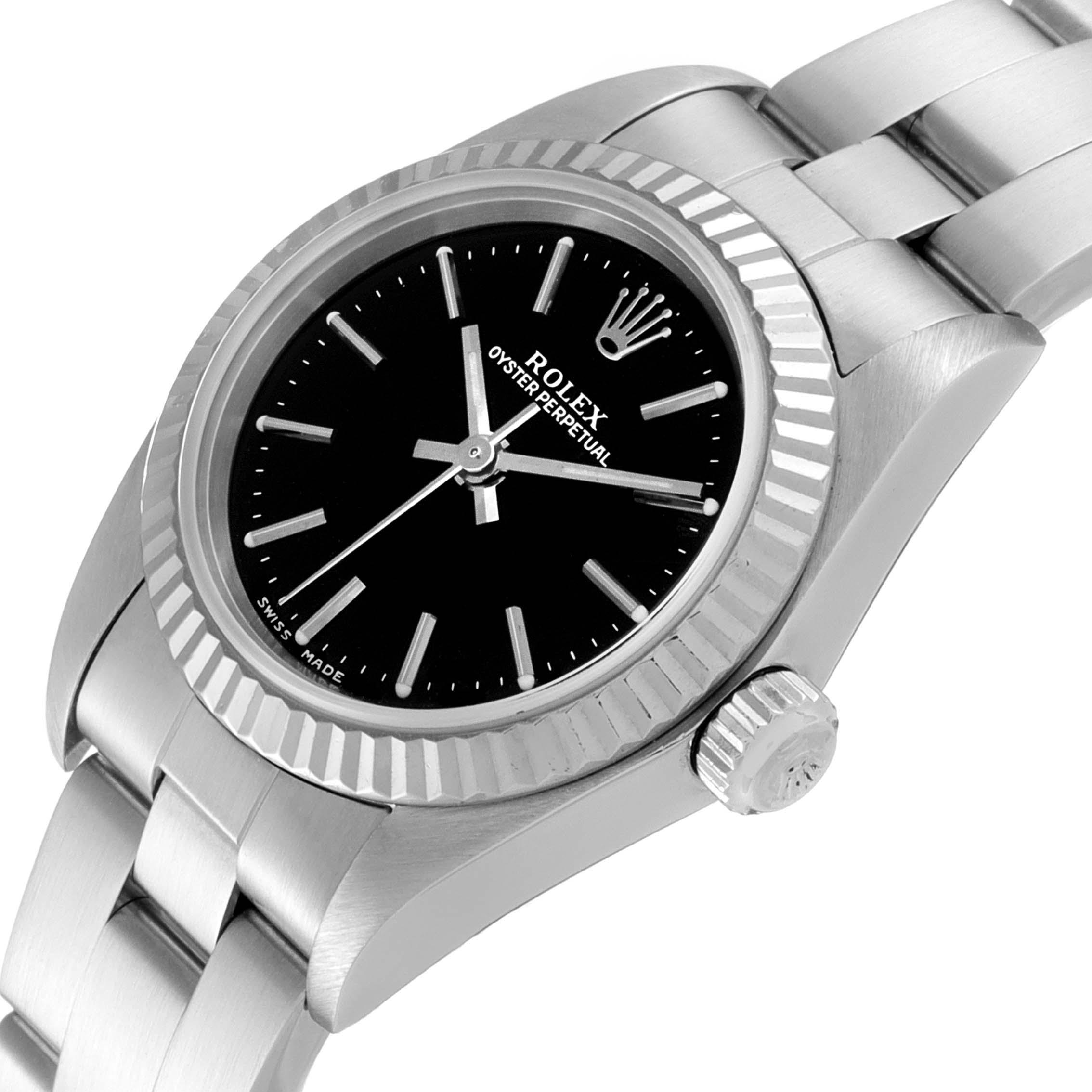 The image shows a close-up angled view of a Rolex Oyster Perpetual 76094 Women's Stainless Steel Black Dial 76094 Women's Stainless Steel Black Dial watch, highlighting its black dial, fluted bezel, and stainless steel bracelet.