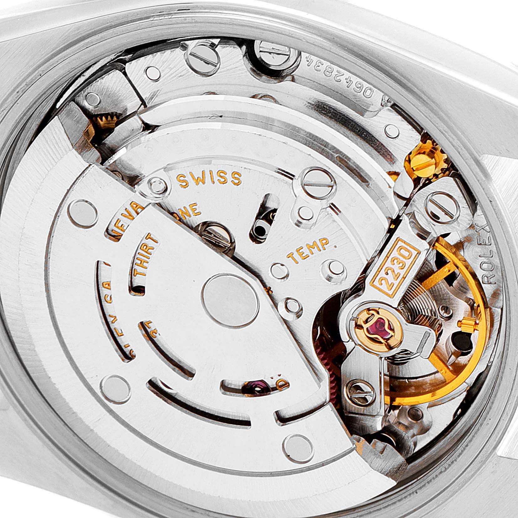 This image shows a close-up of the movement mechanism inside a Rolex Oyster Perpetual 76094 Women's Stainless Steel Black Dial 76094 Women's Stainless Steel Black Dial watch, model 2230.