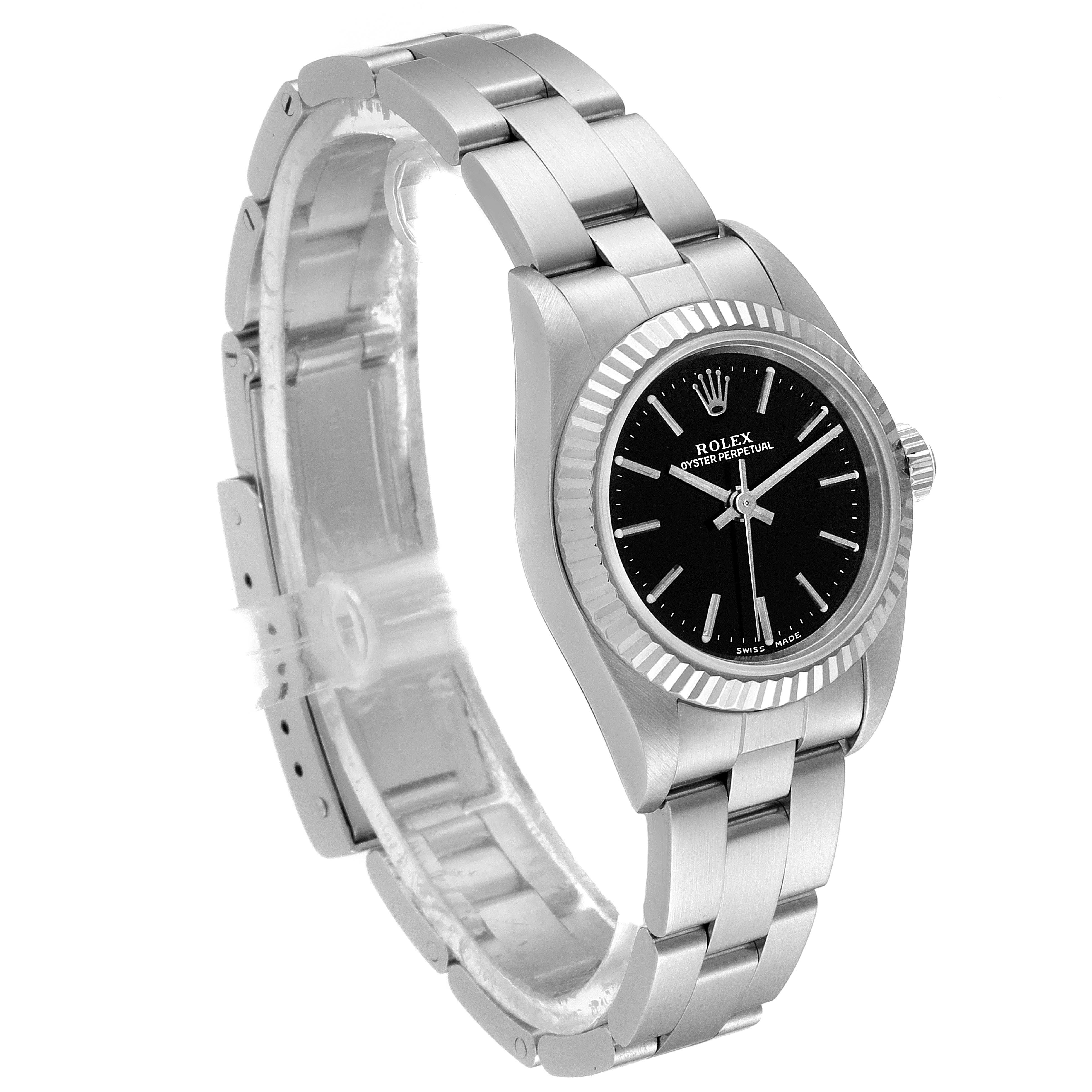 This image features a Rolex Oyster Perpetual 76094 Women's Stainless Steel Black Dial 76094 Women's Stainless Steel Black Dial watch shown at a three-quarter angle, highlighting its bracelet, bezel, and black dial.