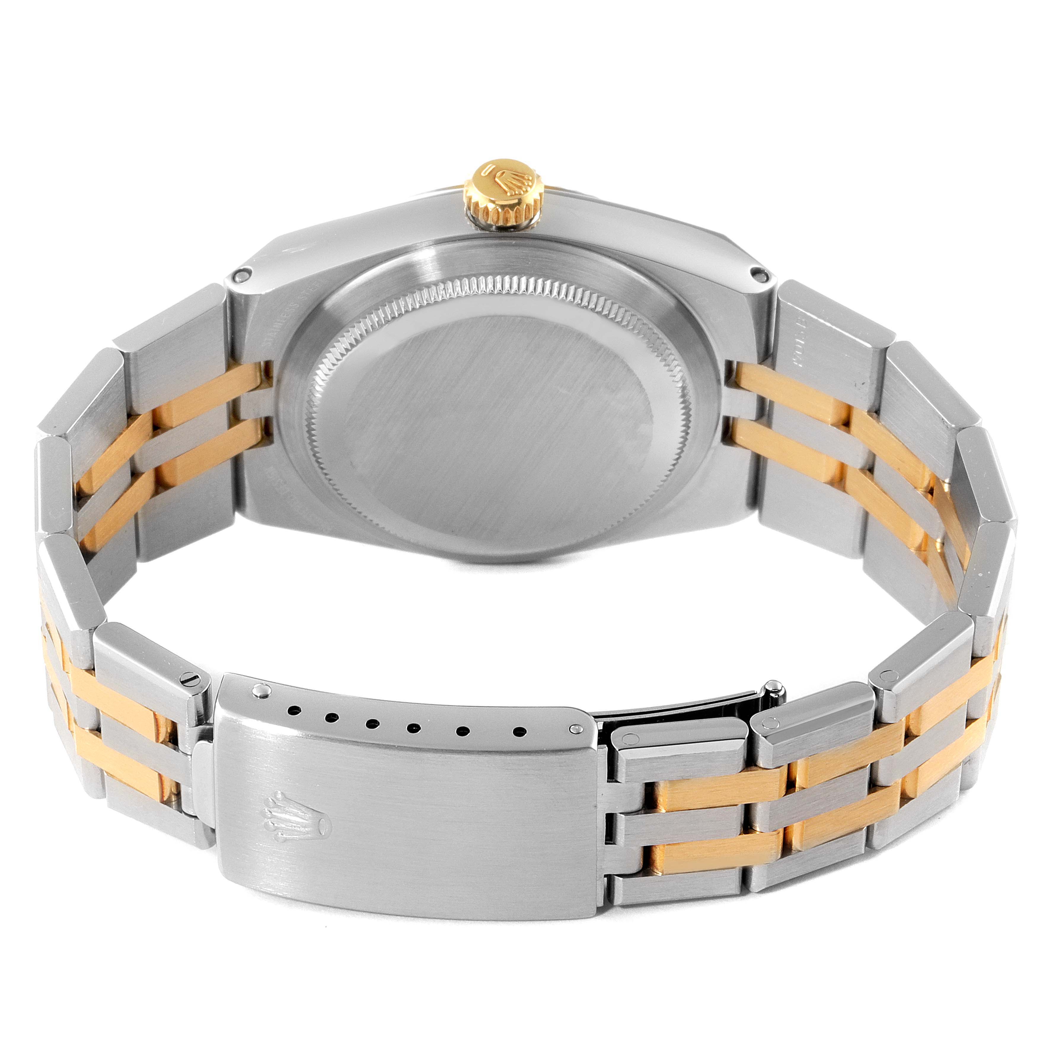 This image shows the back case, crown, and bracelet clasp of a Rolex Oysterquartz 17013 Men's Steel and Gold (two tone) Champagne Dial 17013 Men's Steel and Gold (two tone) Champagne Dial watch from an angled rear view.