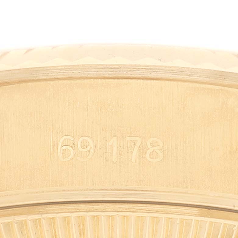 This image shows a close-up of the case side of a Rolex President 69178G Women's Yellow Gold Champagne Dial 69178G Women's Yellow Gold Champagne Dial model watch, focusing on its engraved model number.