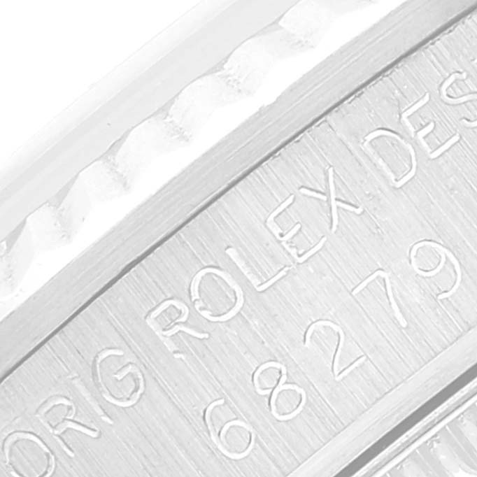 The image shows a close-up of the engraving on the inner bezel of a Rolex President 68279 Women's White Gold Black Dial 68279 Women's White Gold Black Dial model watch.