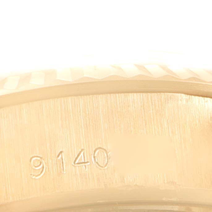 This image shows a close-up of the side of a Rolex President 69178 Women
s Yellow Gold Blue Dial 69178 Women
s Yellow Gold Blue Dial model watch, highlighting the serial number engraving.