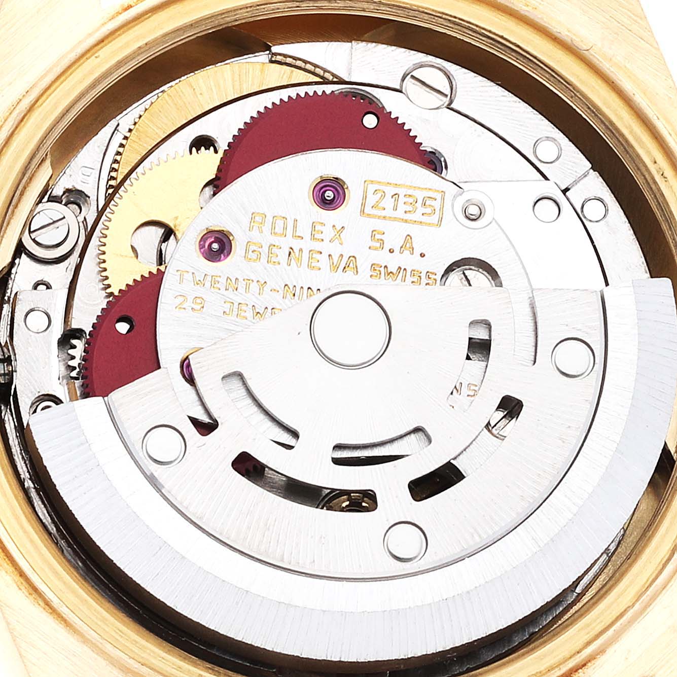 The image shows the inner mechanism of the Rolex President 69188 Women
s Yellow Gold Champagne Dial 69188 Women
s Yellow Gold Champagne Dial model watch, focusing on its intricate movement parts.