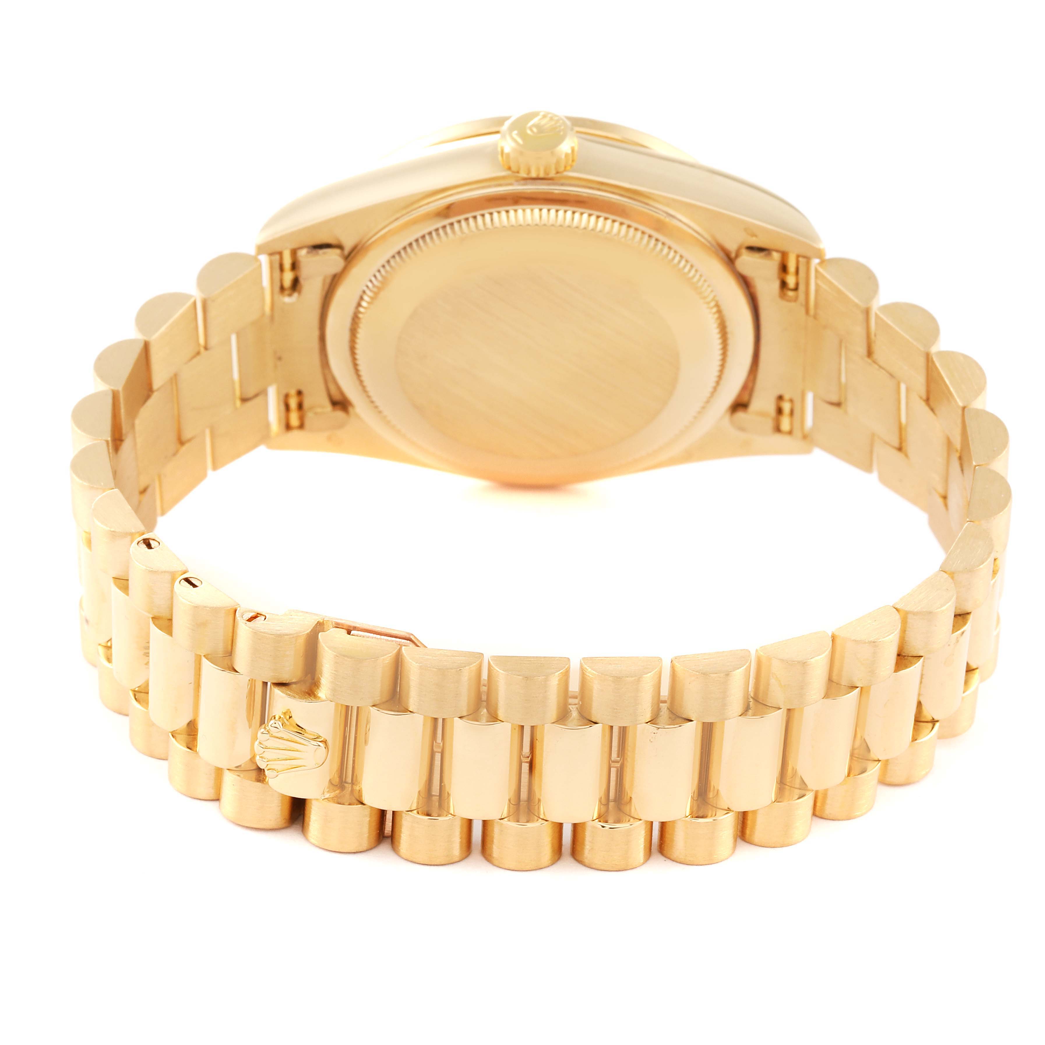 The image shows the back and bracelet of a Rolex President 18348 Men
s Yellow Gold Champagne Dial 18348 Men
s Yellow Gold Champagne Dial model watch, highlighting the gold finish and emblem on the clasp.