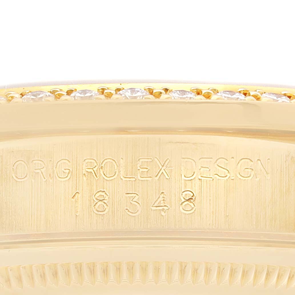 This image shows a close-up of the engraved side and bezel of the Rolex President 18348 Men
s Yellow Gold Champagne Dial 18348 Men
s Yellow Gold Champagne Dial model watch.