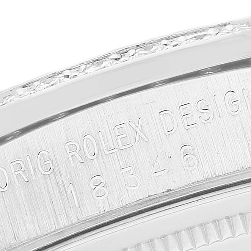 This close-up image shows the engraved text on the case back of a Rolex President 18346 Men's Platinum Silver Dial 18346 Men's Platinum Silver Dial model watch.