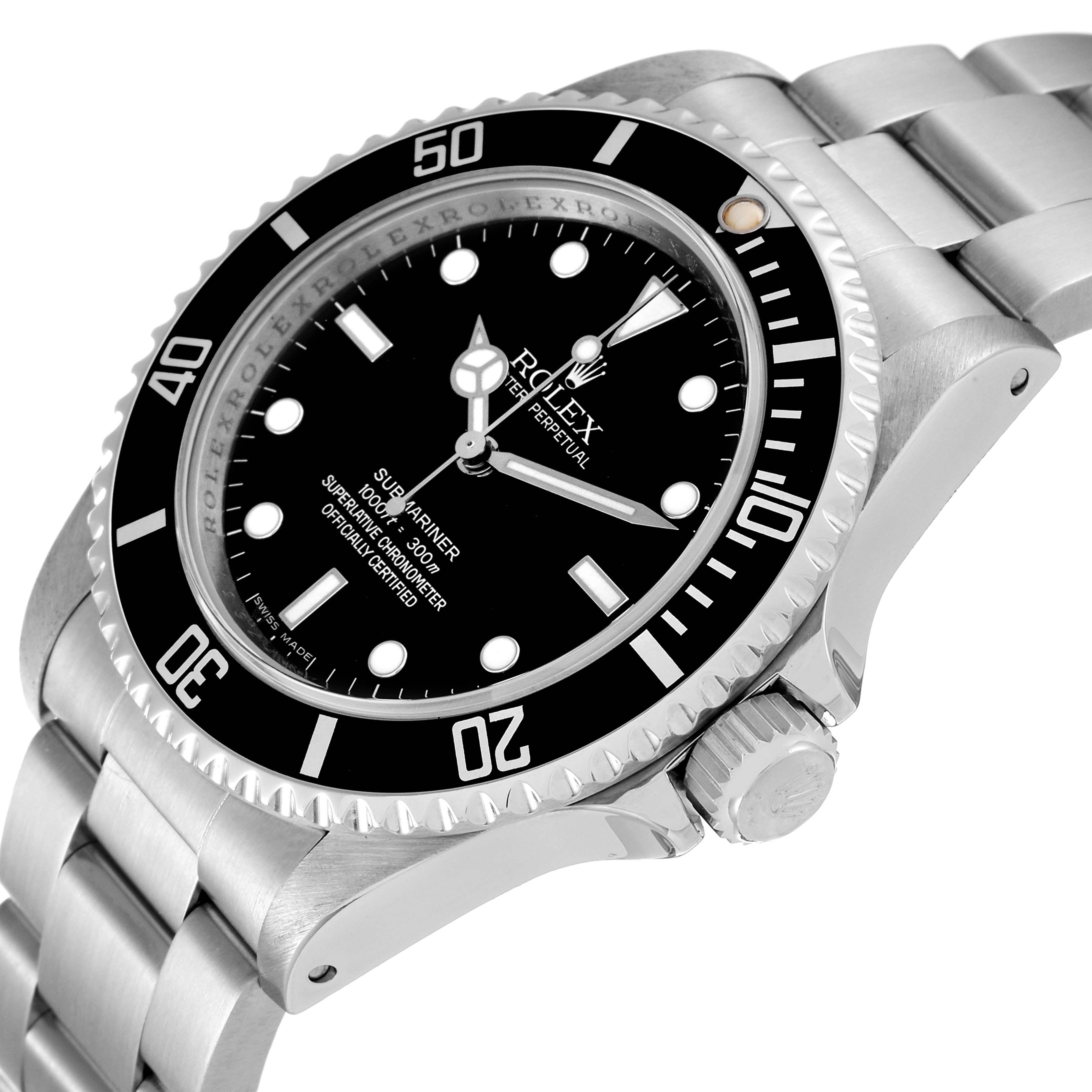 The image shows a Rolex Submariner 14060M Men
s Stainless Steel Black Dial 14060M Men
s Stainless Steel Black Dial watch from an angle highlighting the face, bezel, crown, and parts of the metal bracelet.