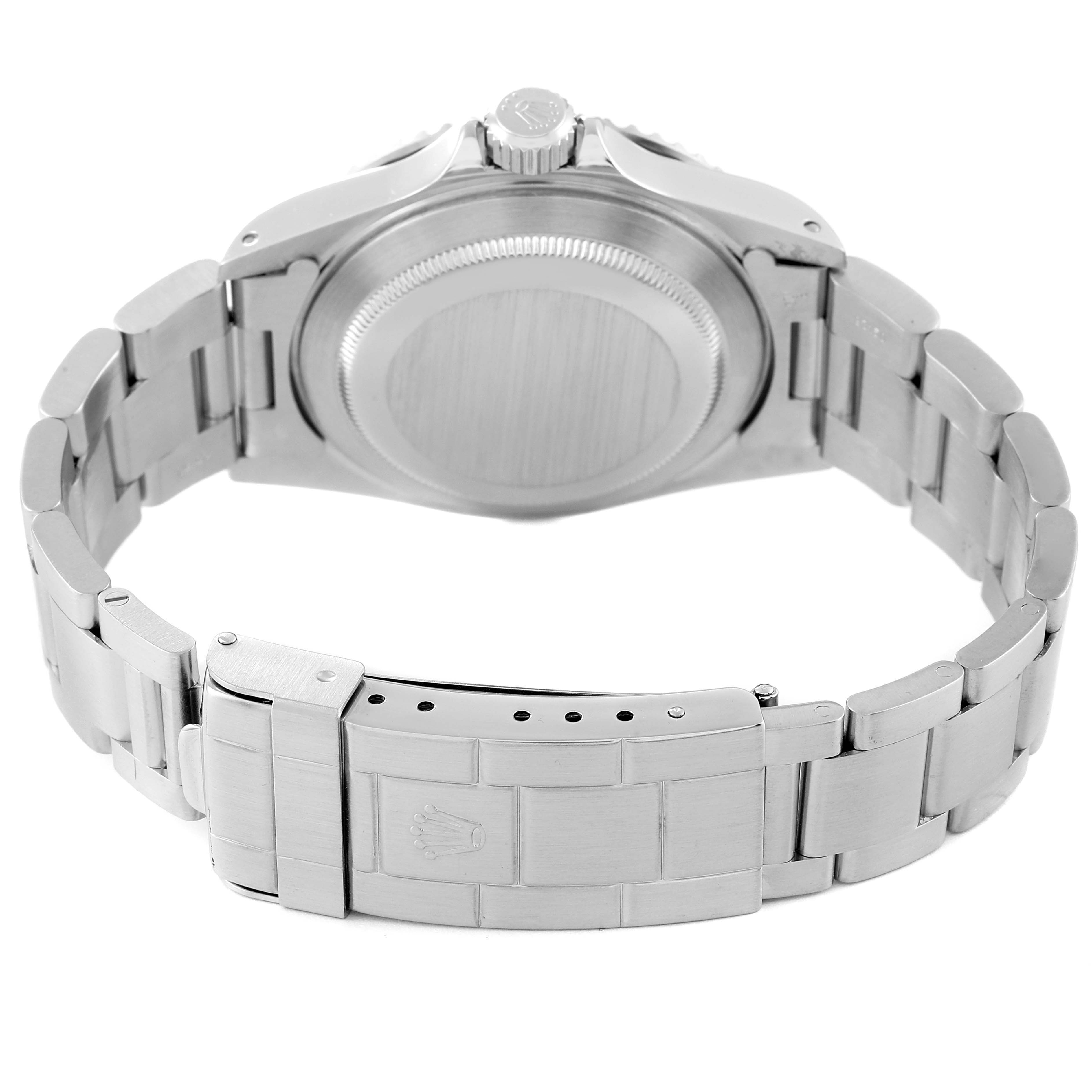 This image shows the back case and stainless steel bracelet of a Rolex Submariner 14060M Men
s Stainless Steel Black Dial 14060M Men
s Stainless Steel Black Dial watch from a rear angle.