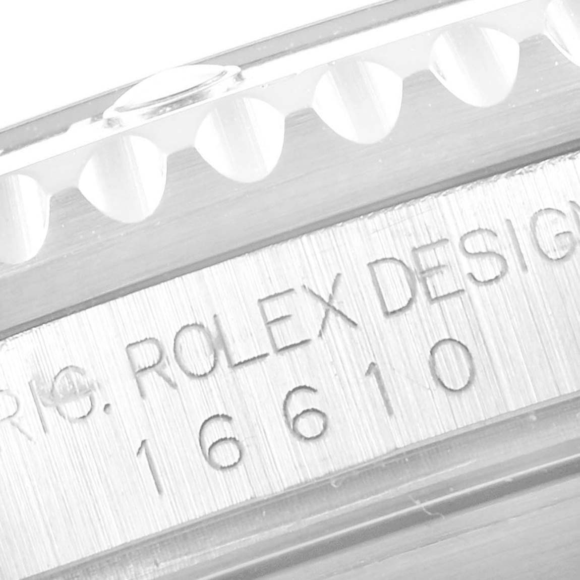 The image shows a close-up of the bezel and case side of a Rolex Submariner 16610 Men
s Stainless Steel Black Dial 16610 Men
s Stainless Steel Black Dial model, highlighting engraved model number 16610.
