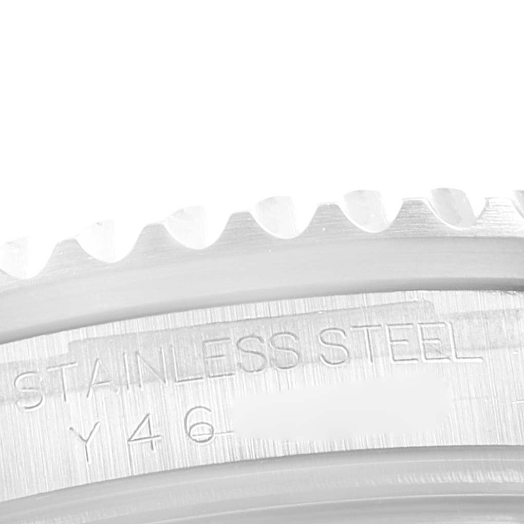This close-up image shows the side of the stainless steel casing near the bezel of a Rolex Submariner 16610 Men
s Stainless Steel Black Dial 16610 Men
s Stainless Steel Black Dial watch.