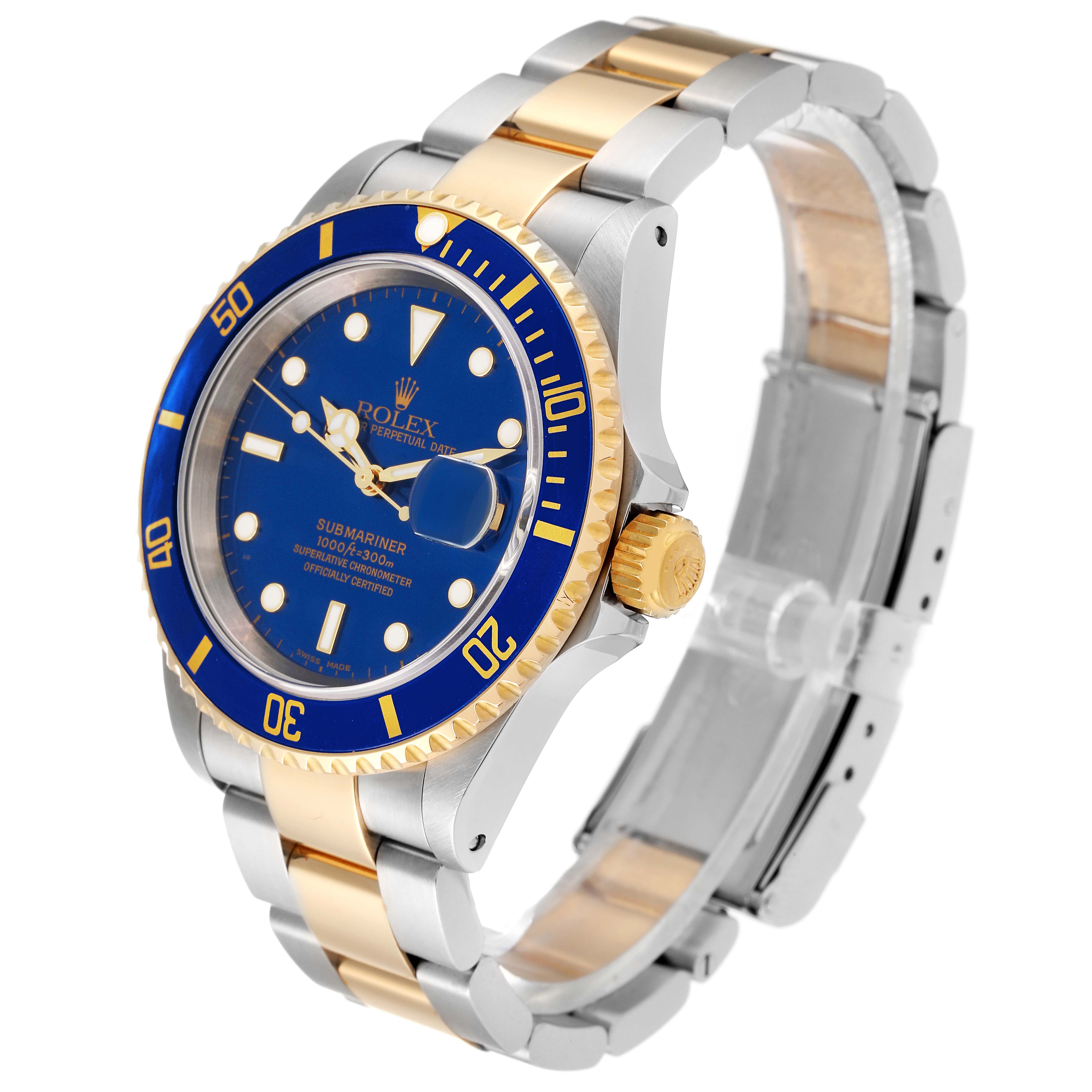 The image shows a Rolex Submariner 16613 Men's Steel and Gold (two tone) Blue Dial 16613 Men's Steel and Gold (two tone) Blue Dial watch from a three-quarter angle, highlighting the blue dial, bezel, and two-tone bracelet.