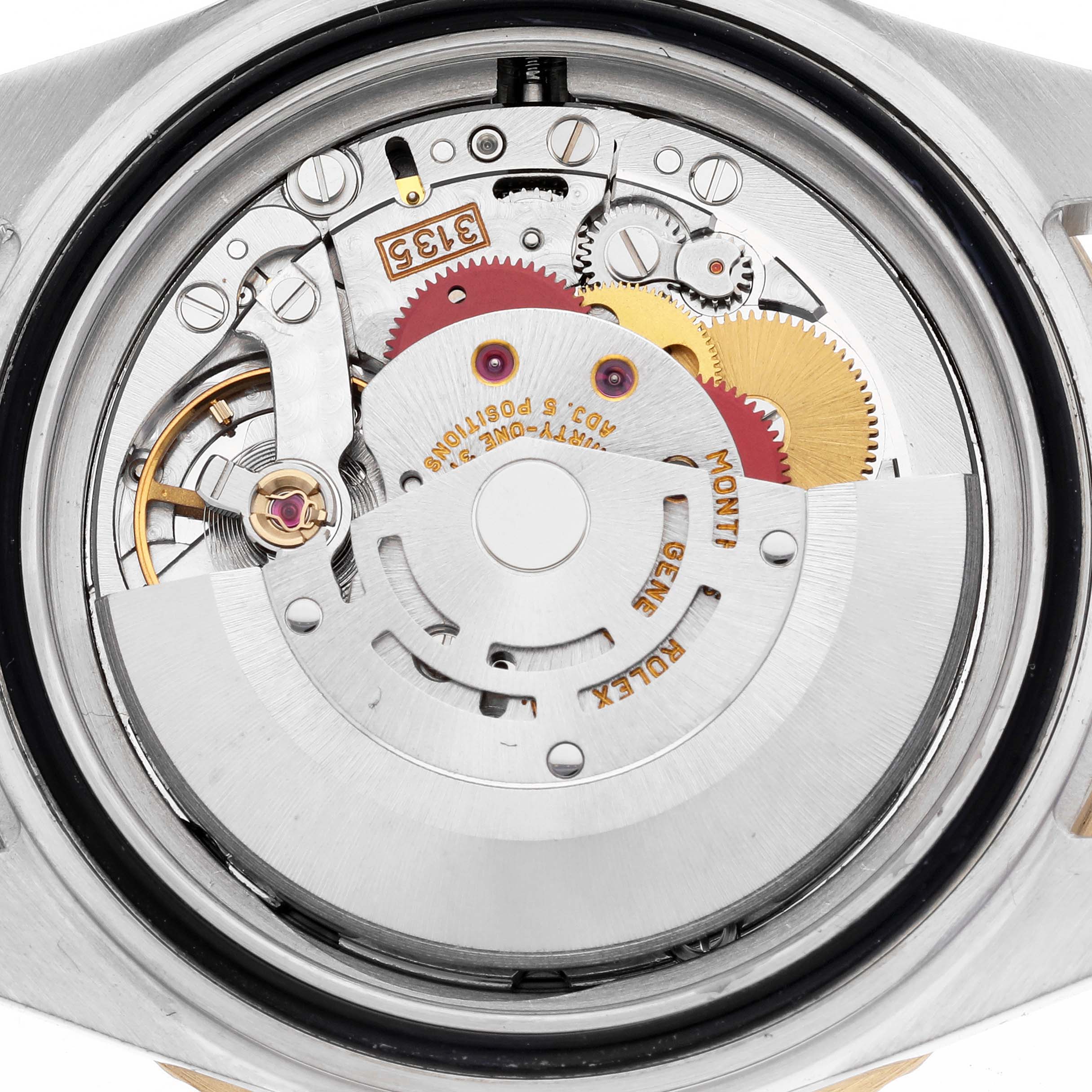 The image shows the movement mechanism of a Rolex Submariner 16613 Men's Steel and Gold (two tone) Grey Dial 16613 Men's Steel and Gold (two tone) Grey Dial from the back angle.