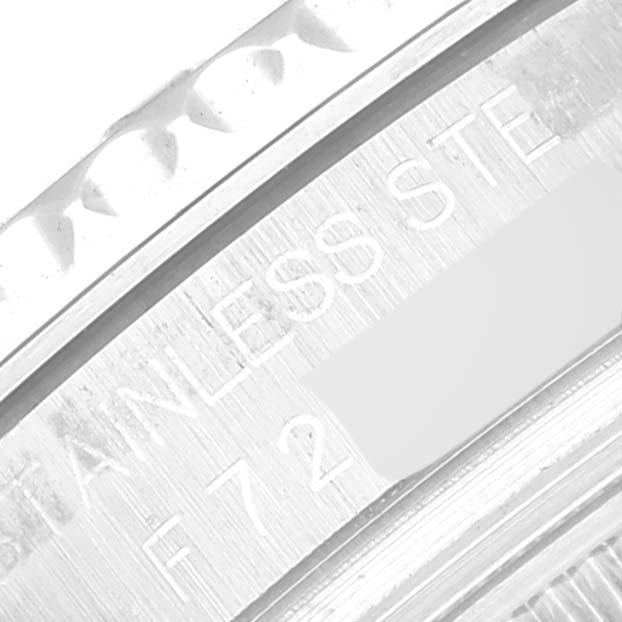 This image shows an extreme close-up of the engraved serial number and "STAINLESS STEEL" inscription on the side of a Rolex Yacht-Master 168622 Men's Stainless Steel Silver Dial 168622 Men's Stainless Steel Silver Dial watch.