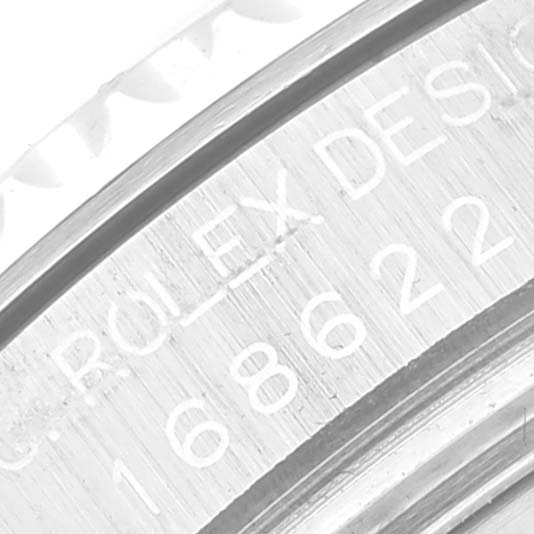 A close-up of the Rolex Yacht-Master 168622 Men's Stainless Steel Silver Dial 168622 Men's Stainless Steel Silver Dial watch showing part of the inner bezel with engraved text.