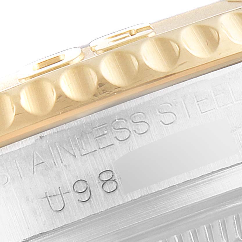 This image shows a close-up of the stainless steel case and gold bezel of a Rolex Yacht-Master 68623 Men's Steel and Gold (two tone) White Dial 68623 Men's Steel and Gold (two tone) White Dial watch.