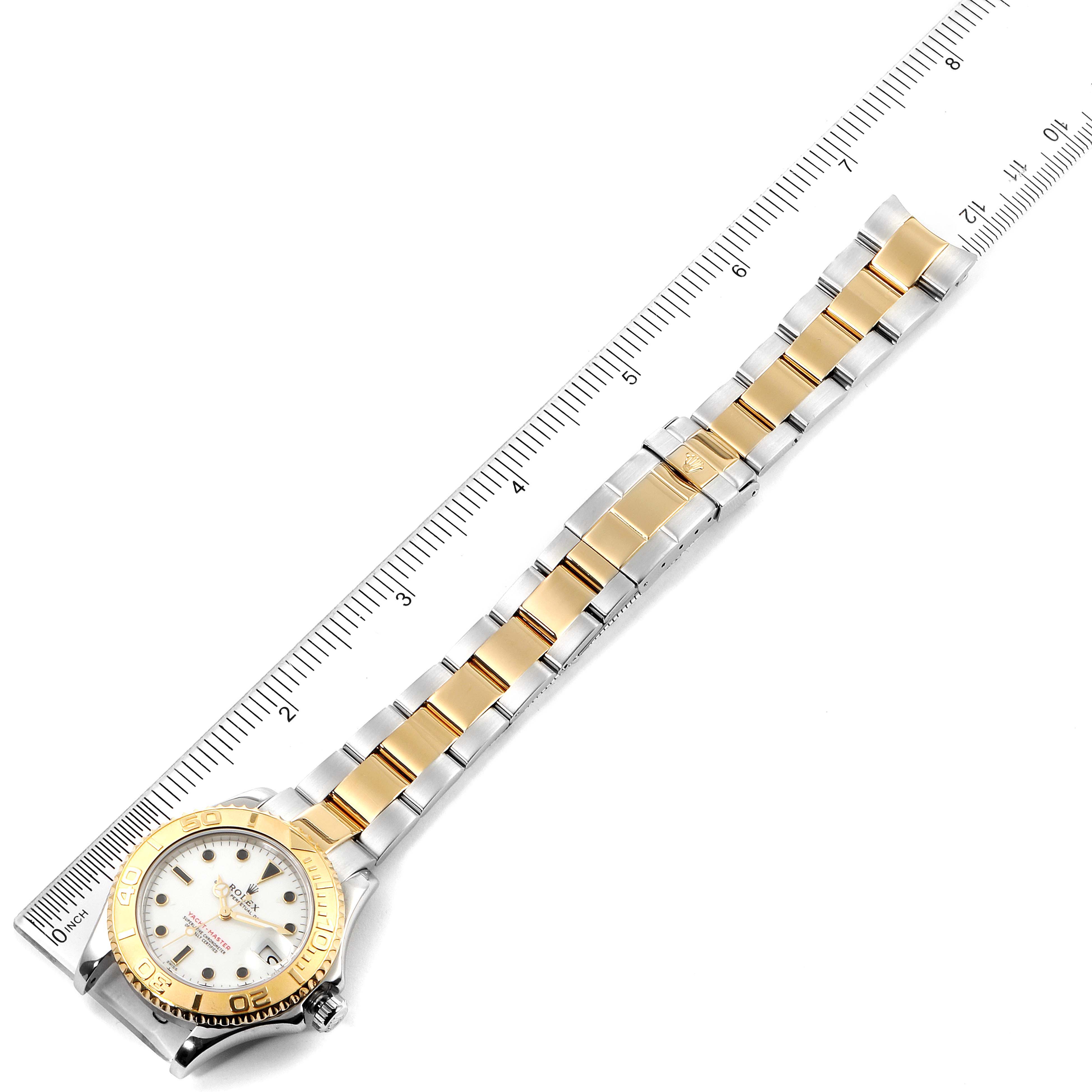 The Rolex Yacht-Master 68623 Men's Steel and Gold (two tone) White Dial 68623 Men's Steel and Gold (two tone) White Dial watch is shown from a top-down angle, displaying the entire watch including the face, bezel, and bracelet.