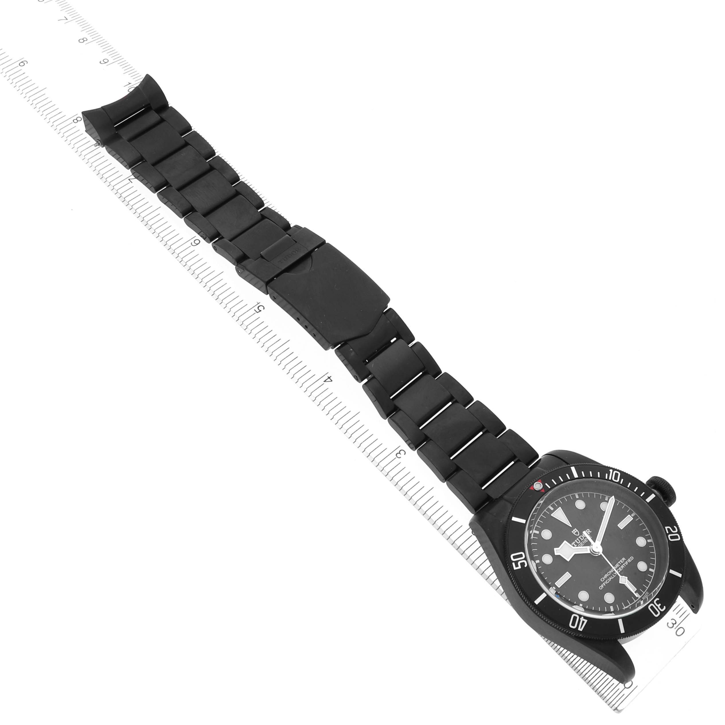 The Tudor Heritage Black Bay 79230DK Men
s Stainless Steel Black Dial 79230DK Men
s Stainless Steel Black Dial watch is shown from a top angle with a full view of the face and strap.