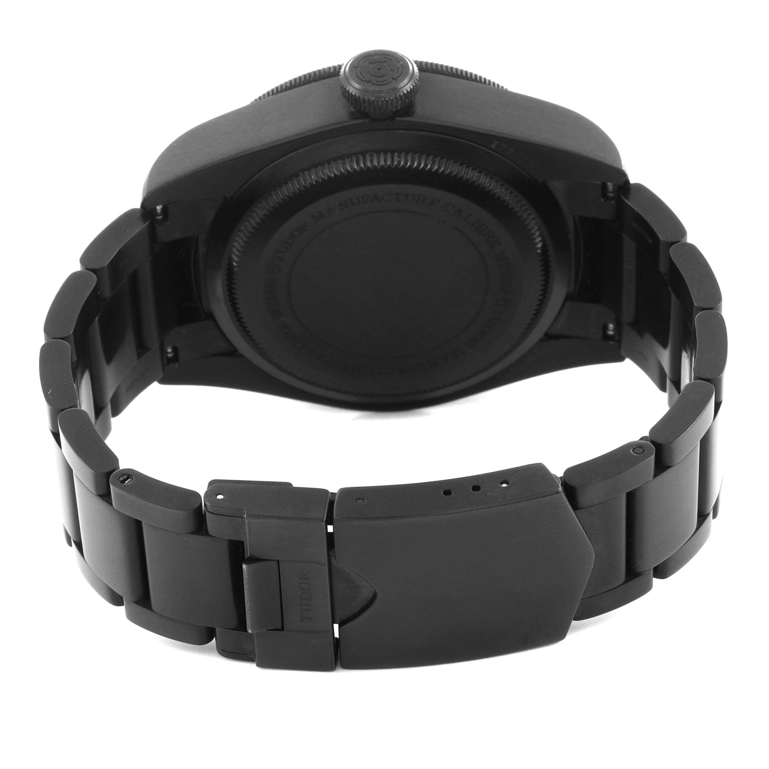 The image shows the back view of a Tudor Heritage Black Bay 79230DK Men
s Stainless Steel Black Dial 79230DK Men
s Stainless Steel Black Dial watch, highlighting the case back and bracelet clasp.