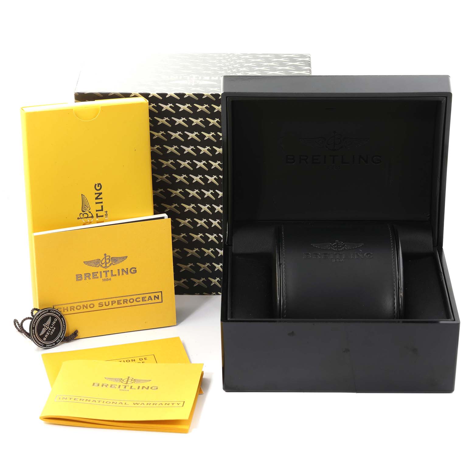 The image shows an open box, booklets, a tag, and packaging for a Breitling Superocean A13340 Men's Stainless Steel Black Dial A13340 Men's Stainless Steel Black Dial watch.