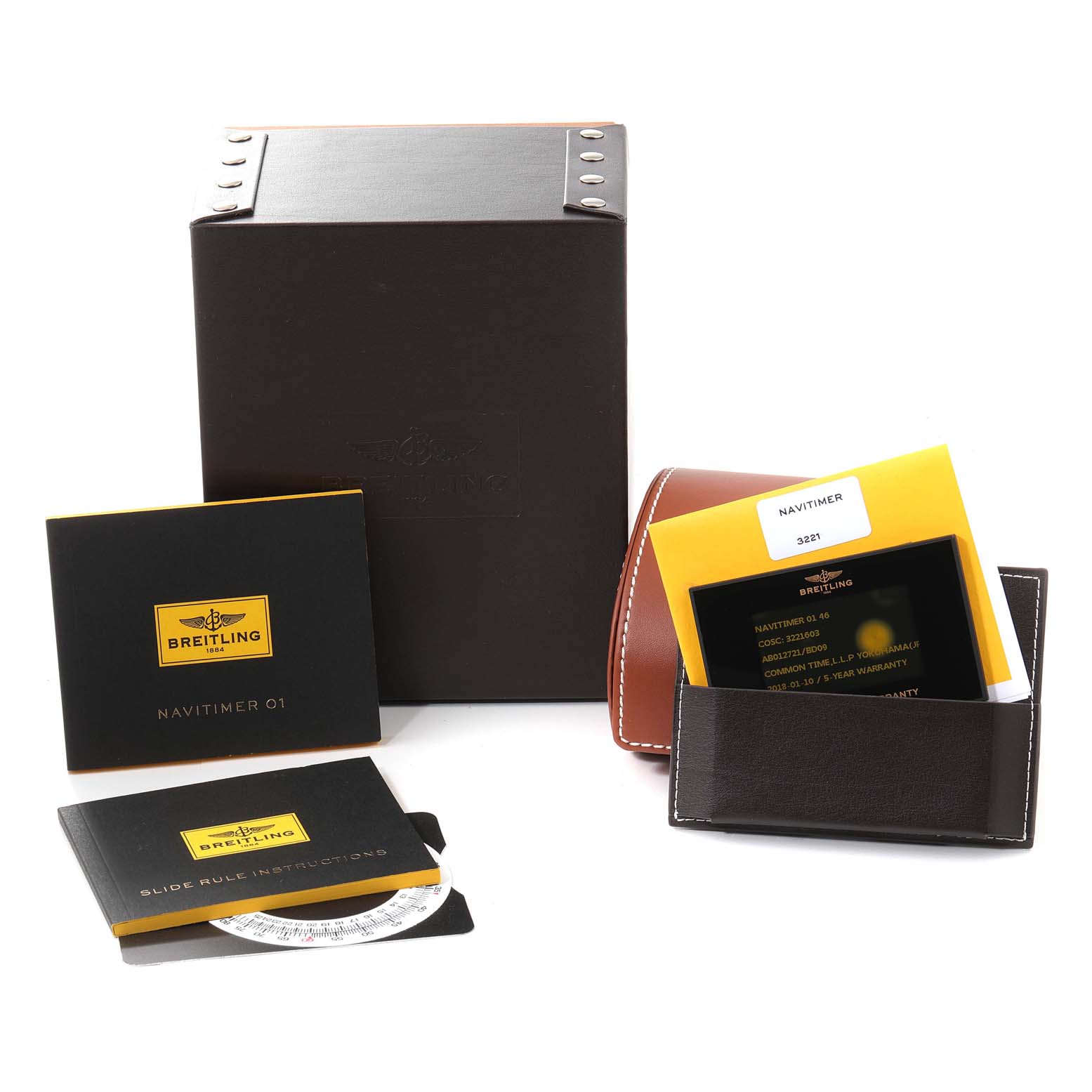 The image shows the packaging and accessories for the Breitling Navitimer AB0127-211-B1A1 Men
s Stainless Steel Black Dial AB0127-211-B1A1 Men
s Stainless Steel Black Dial watch, including manuals and a warranty card.