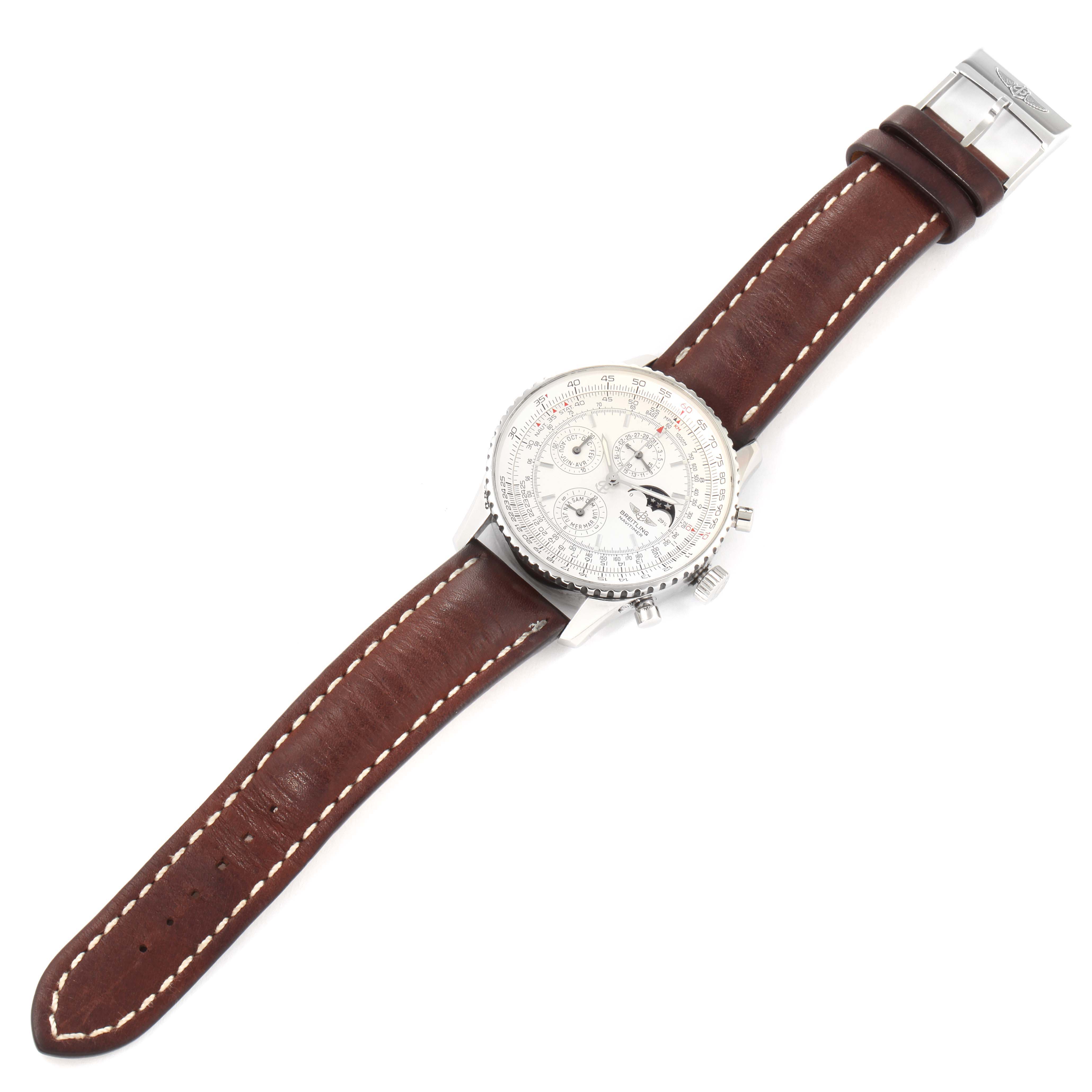 This image shows a Breitling Navitimer A19340 Men's Stainless Steel Silver Dial A19340 Men's Stainless Steel Silver Dial watch from a top-down angle, featuring a white dial and a brown leather strap with white stitching.