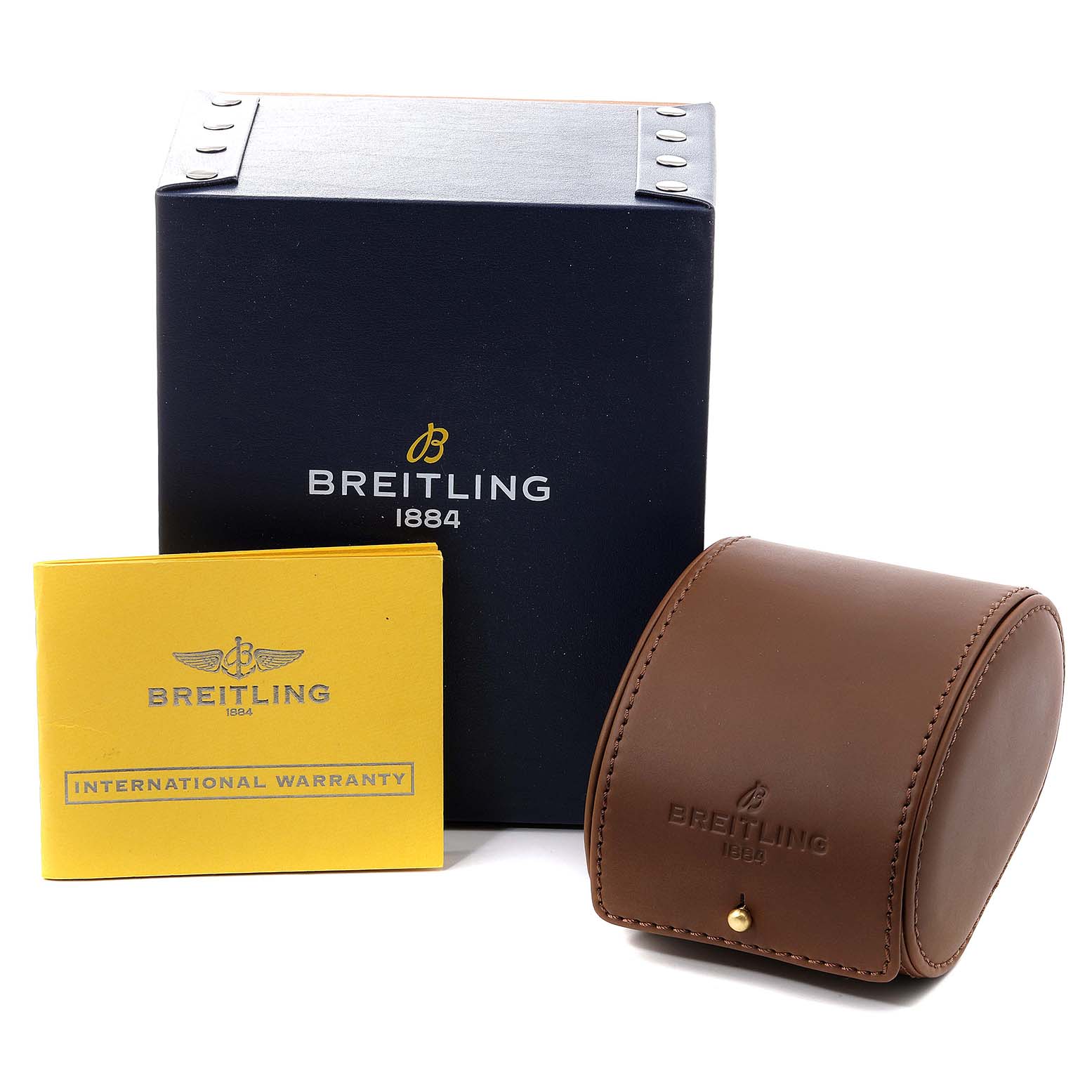 The image shows the Superocean model by Breitling in its packaging, along with the warranty card and a brown leather travel case.