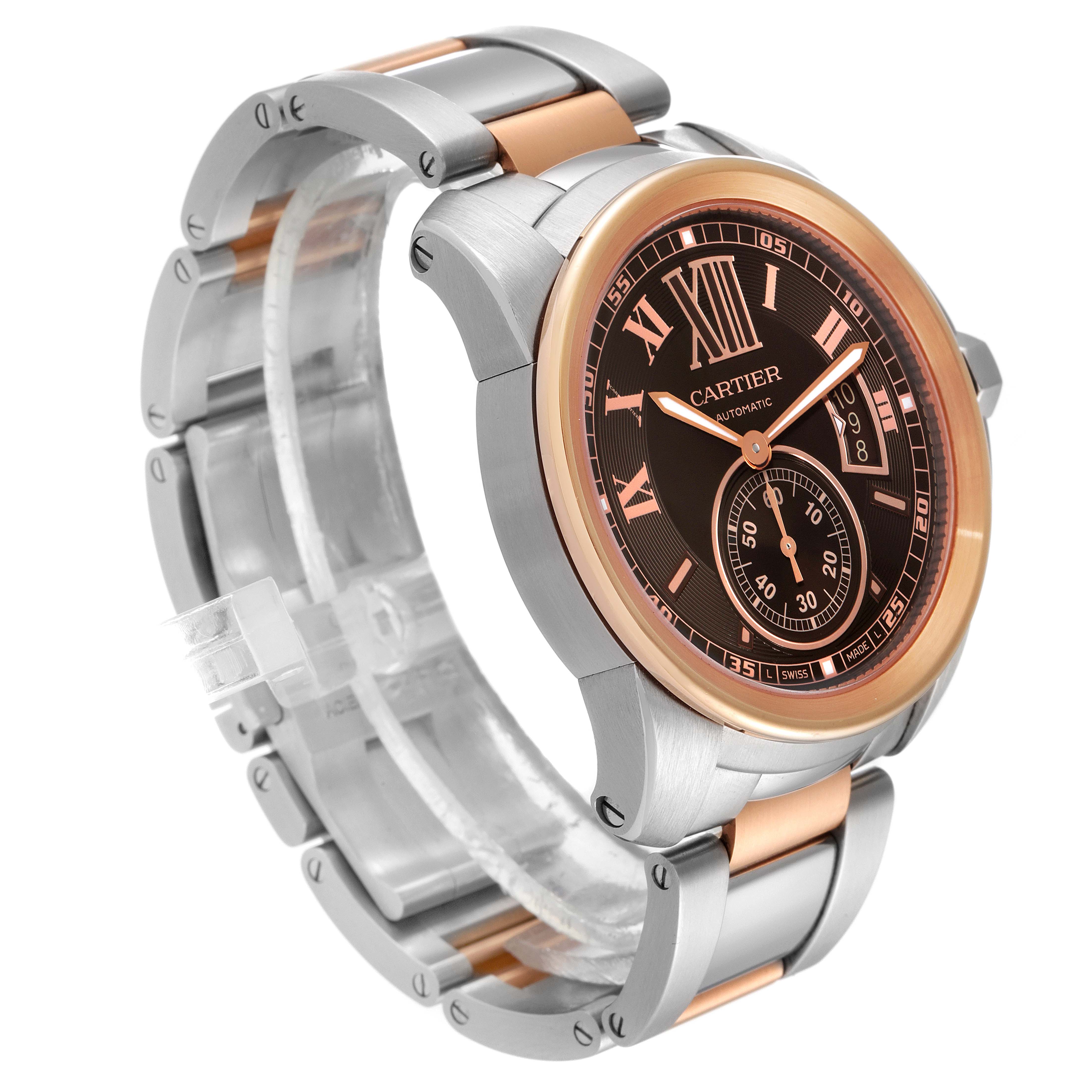 The image shows a Calibre de Cartier watch by Cartier at an angled view, highlighting the watch face and part of the metal bracelet.