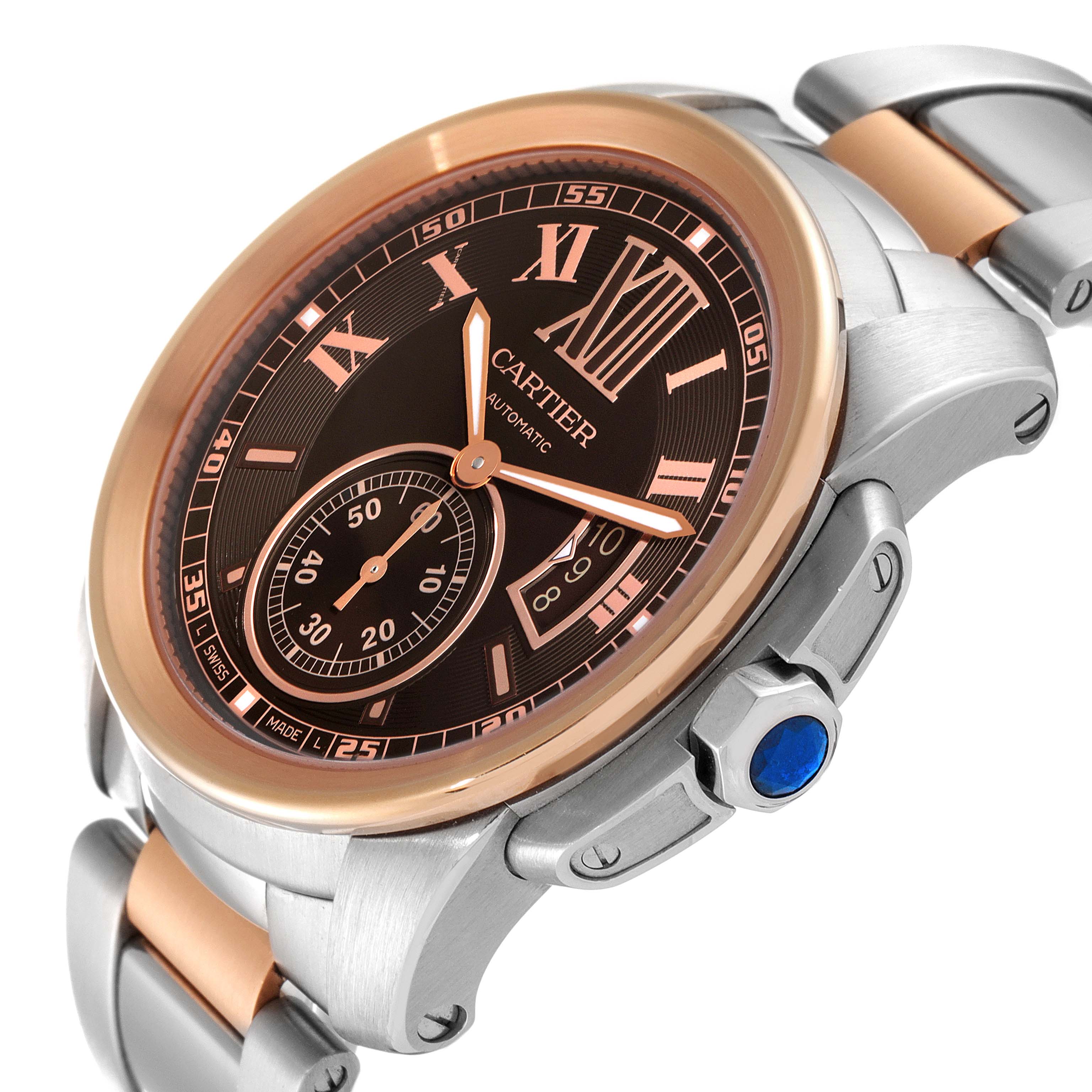 The Calibre de Cartier watch by Cartier is shown from a slightly tilted angle, displaying the dial, bezel, and part of the bracelet.