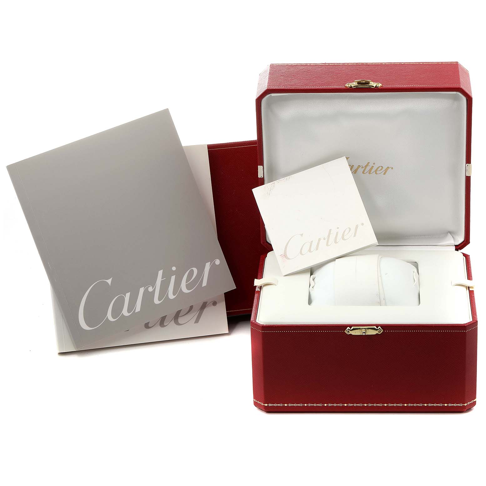 The Cartier Santos W20099C4 Men
s Steel and Gold (two tone) Silver Dial W20099C4 Men
s Steel and Gold (two tone) Silver Dial watch box and documentation are displayed at an angle showing the interior, manuals, and outer red case.