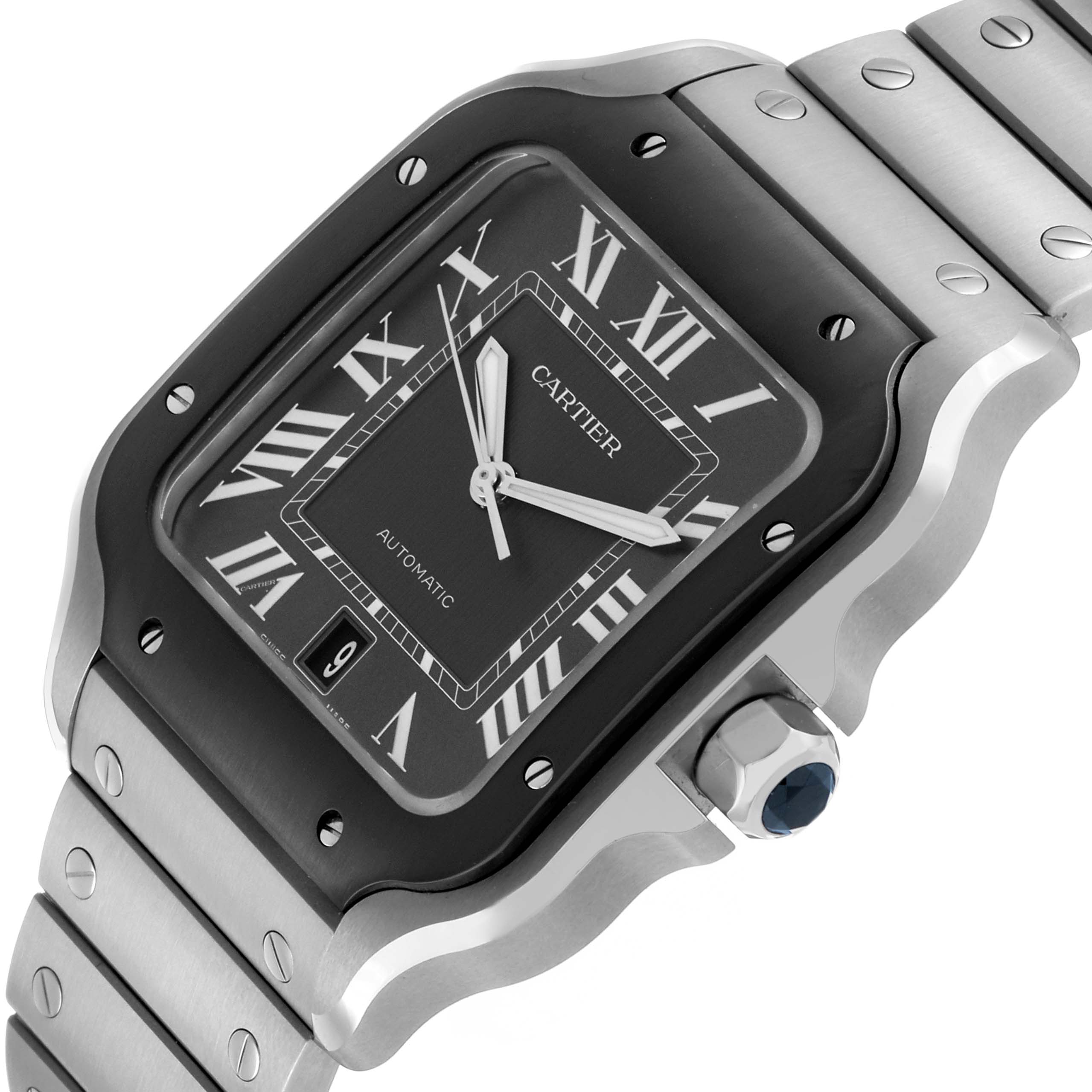 The Cartier Santos WSSA0037 Men's Stainless Steel Grey Dial watch is shown at a slight angle featuring its face, bezel, bracelet, and crown with a blue gemstone.