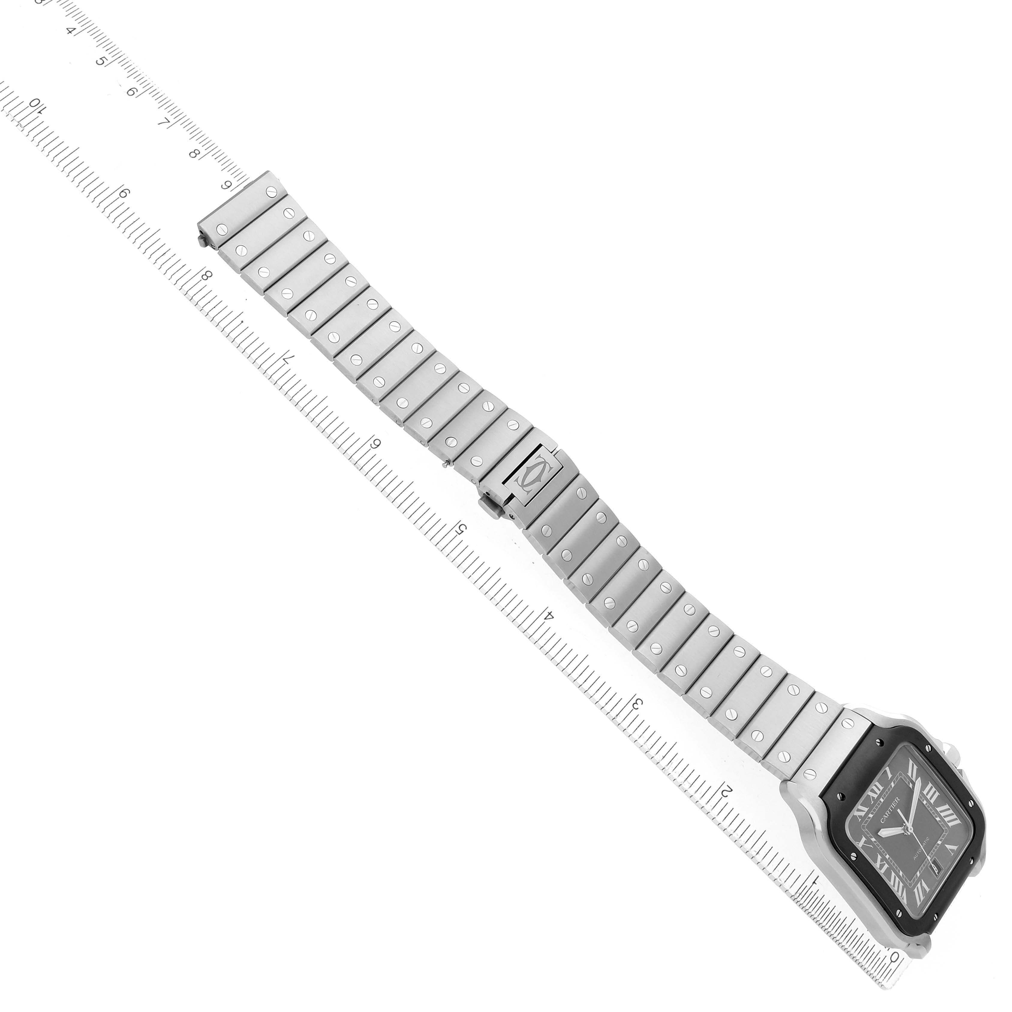 The image shows a Santos model by Cartier at an angled overhead view, highlighting the watch's face and metal bracelet.