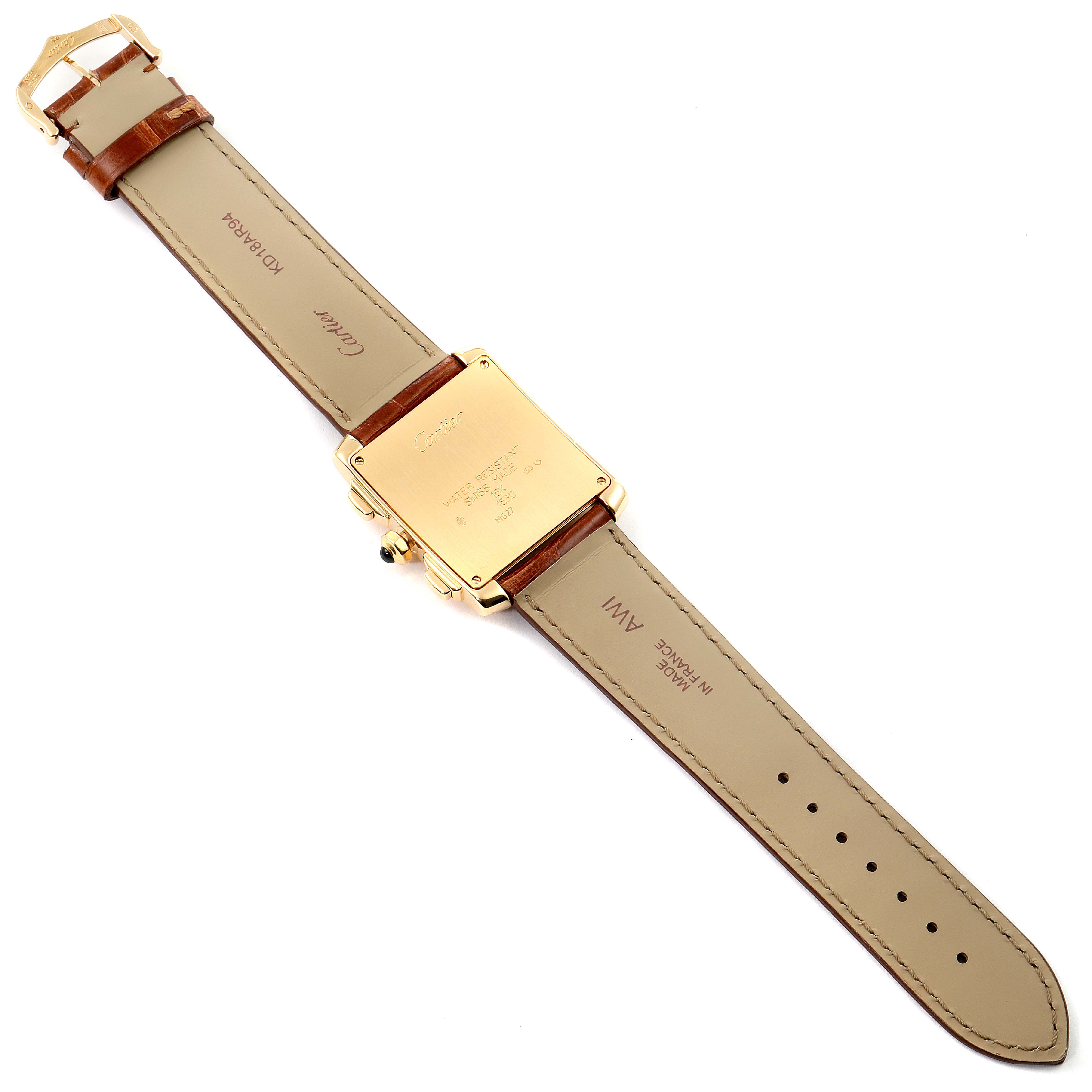 The Cartier Tank Francaise W5000556 Men's Yellow Gold Silver Dial W5000556 Men's Yellow Gold Silver Dial watch is shown from the back, highlighting the case back, crown, and leather strap.