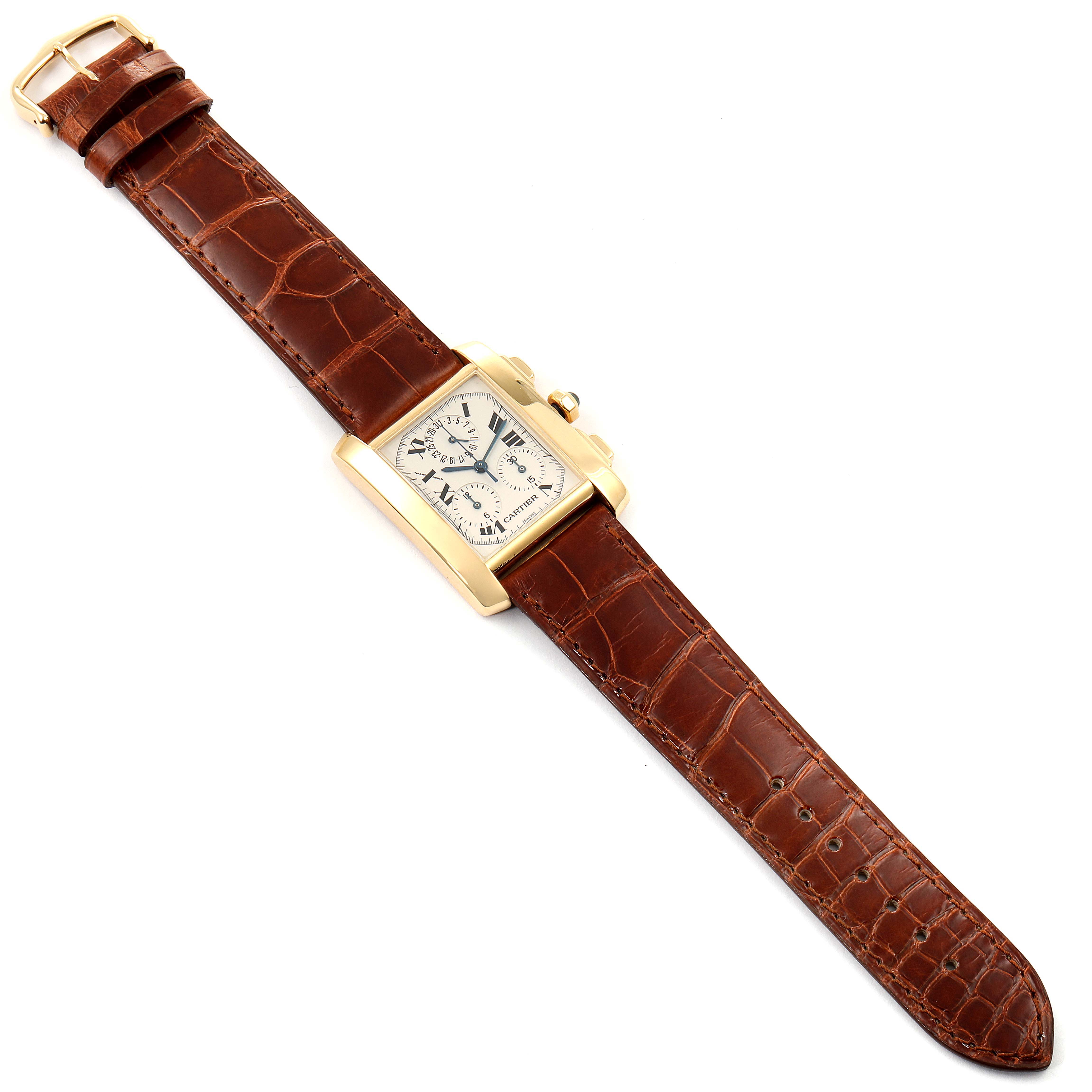 The Cartier Tank Francaise W5000556 Men's Yellow Gold Silver Dial W5000556 Men's Yellow Gold Silver Dial watch is shown from a top-down angle, featuring its rectangular face and brown leather strap.