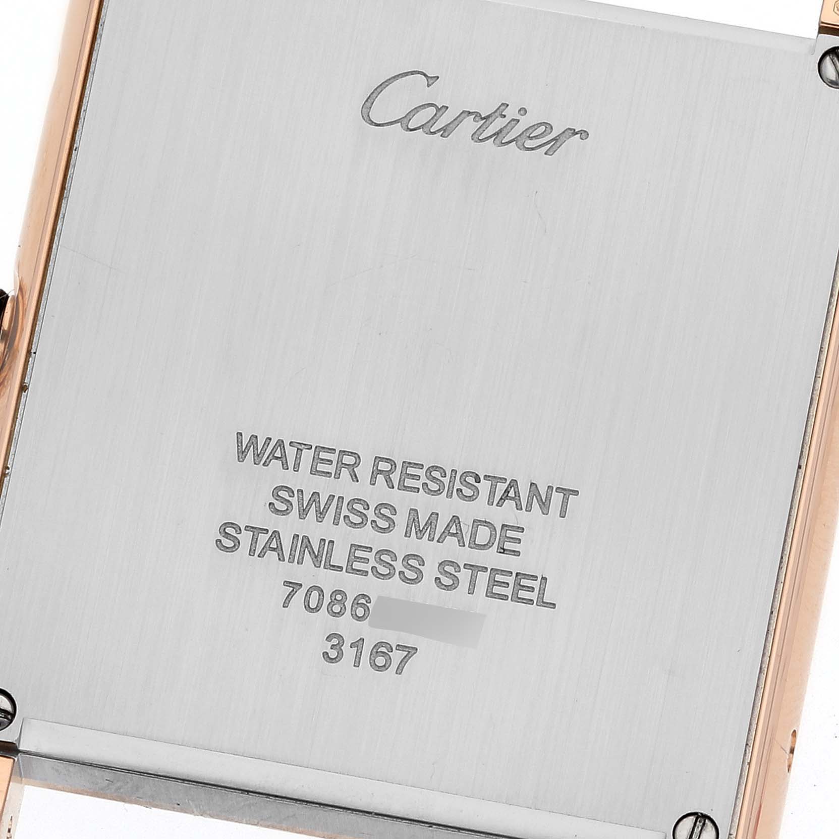 This image shows the back case of a Cartier Tank Solo W5200025 Men
s Steel and Gold (two tone) Silver Dial W5200025 Men
s Steel and Gold (two tone) Silver Dial watch, displaying its inscriptions.