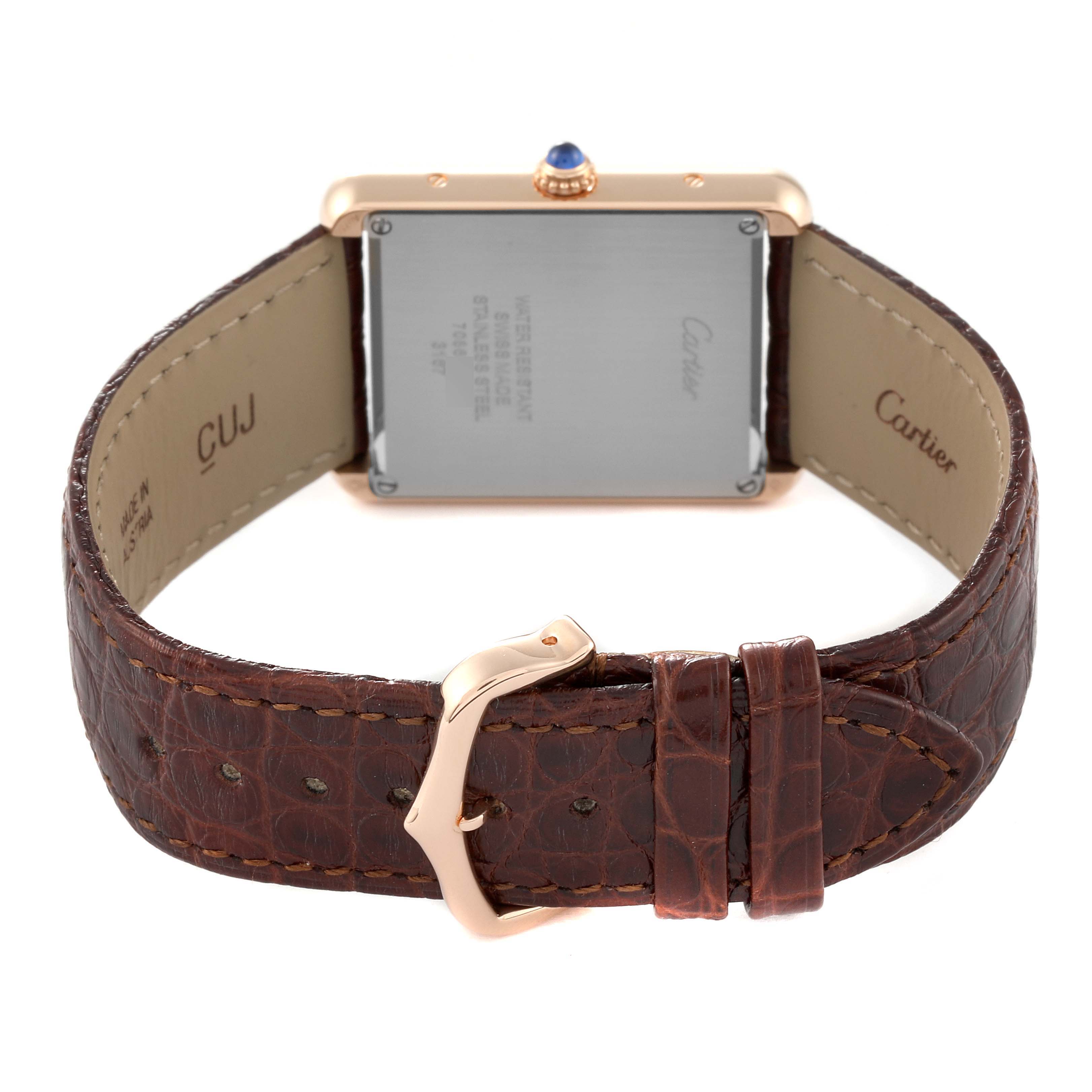 The image shows the back view of the Cartier Tank Solo W5200025 Men
s Steel and Gold (two tone) Silver Dial W5200025 Men
s Steel and Gold (two tone) Silver Dial watch, highlighting its leather strap and stainless steel case back.