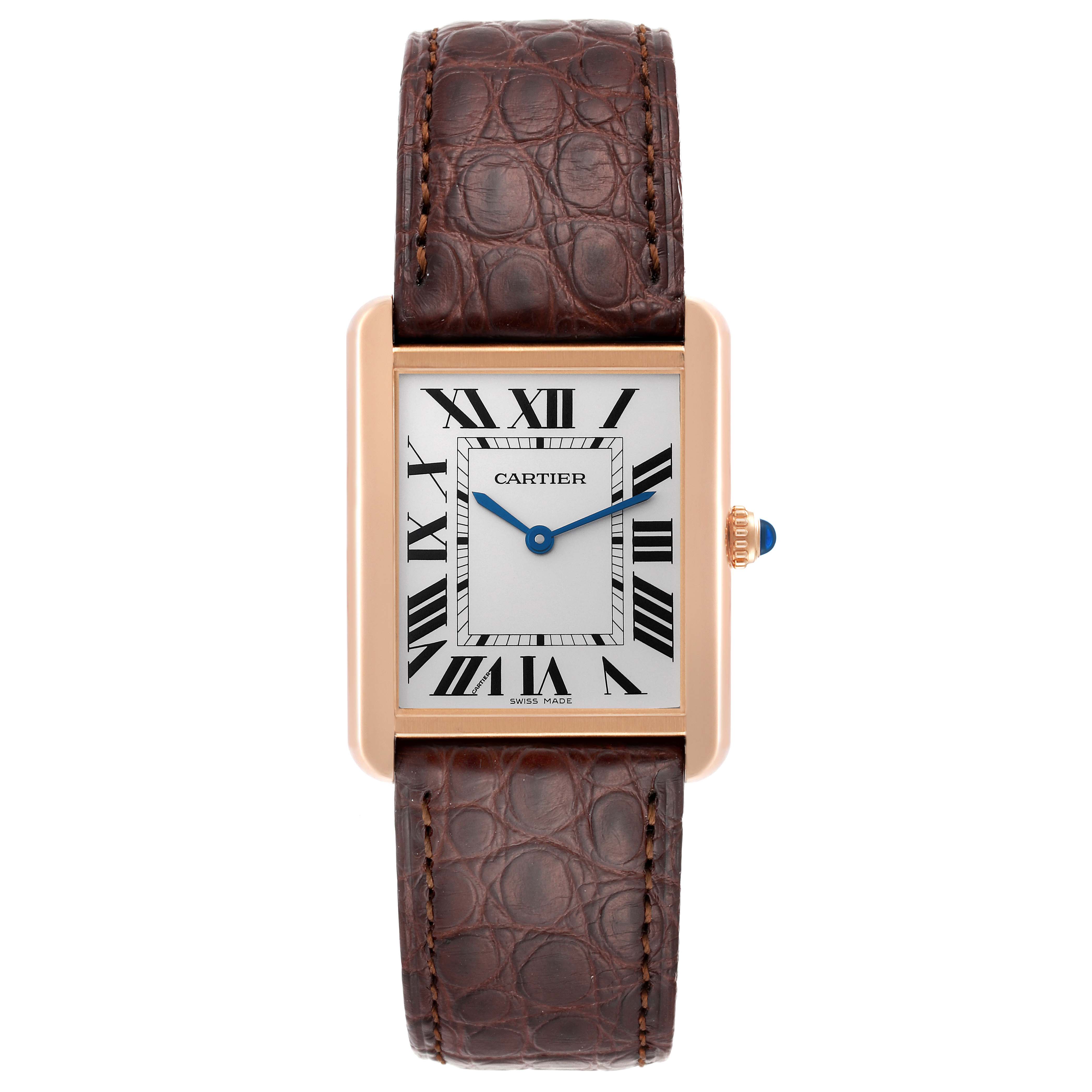 This image shows a front view of a Cartier Tank Solo W5200025 Men
s Steel and Gold (two tone) Silver Dial W5200025 Men
s Steel and Gold (two tone) Silver Dial watch with a brown leather strap and Roman numeral dial.