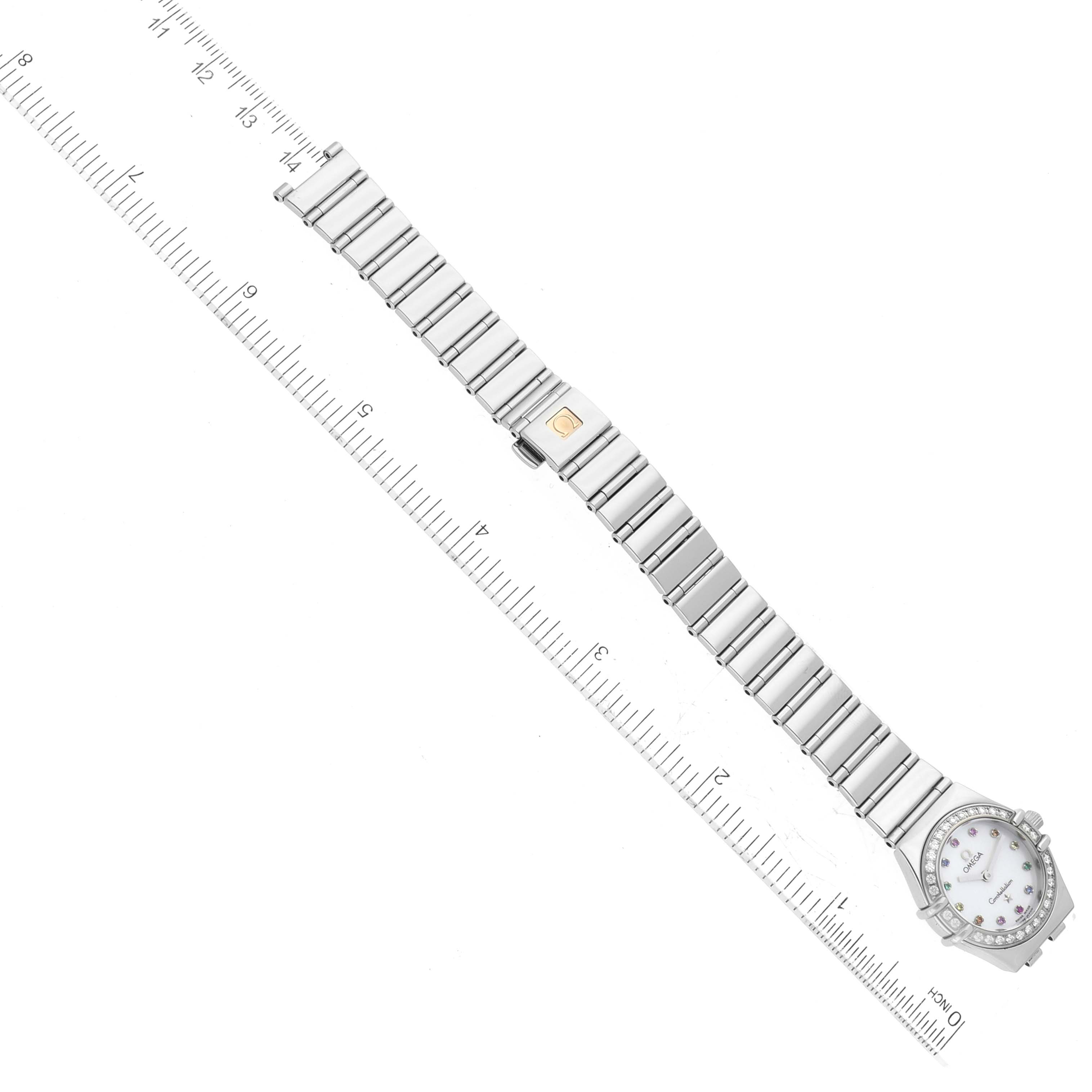 The Omega 1465.79.00 Women's Stainless Steel Mother of Pearl Dial 1465.79.00 Women's Stainless Steel Mother of Pearl Dial Constellation Iris Mother Of Pearl Diamond Steel Ladies Watch 1465.79.00 is shown in a top-down view, with a ruler alongside it.