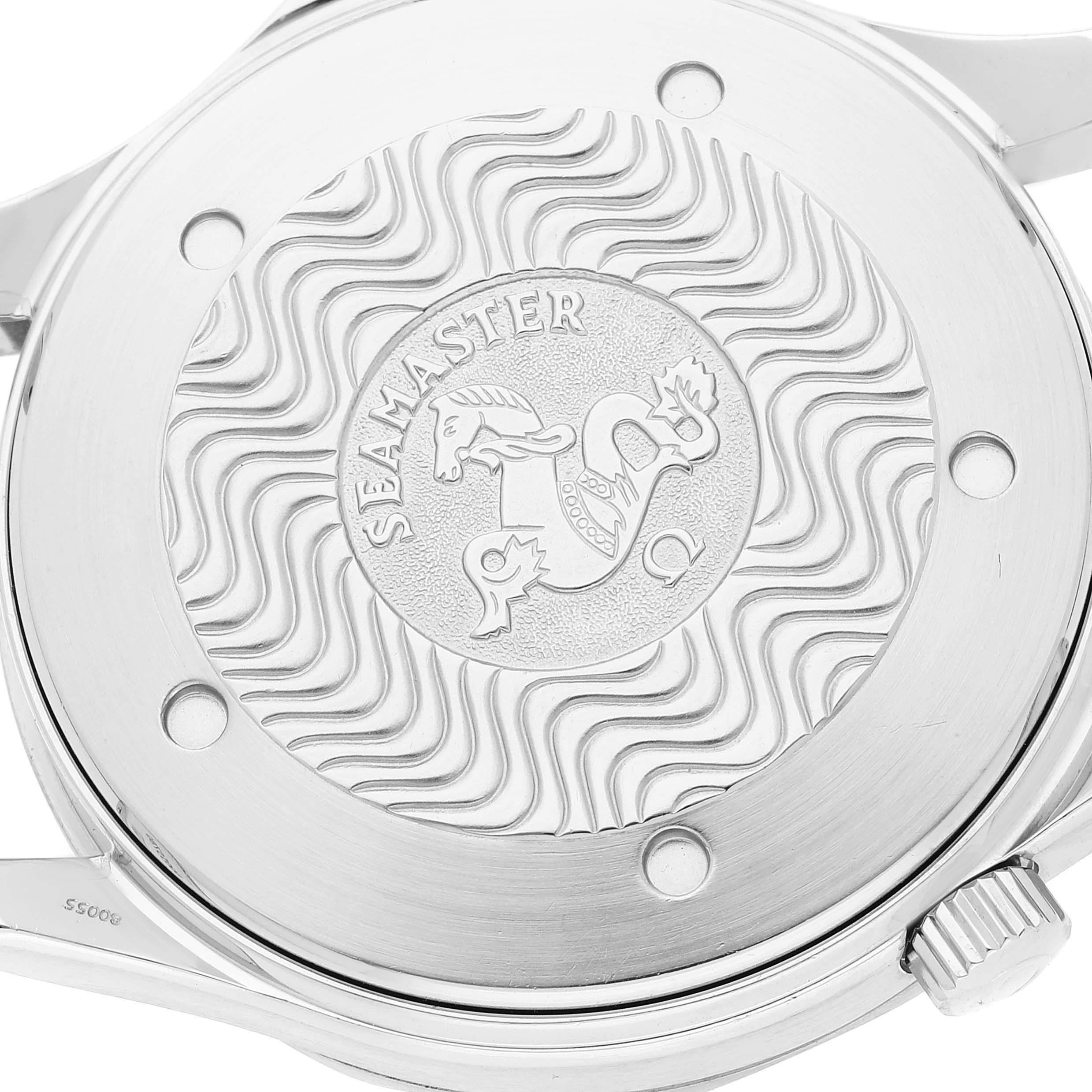 The image shows the back case of an Omega Seamaster 2255.80.00 Men's Stainless Steel Blue Dial 2255.80.00 Men's Stainless Steel Blue Dial watch, highlighting the engraved logo and wavy pattern.