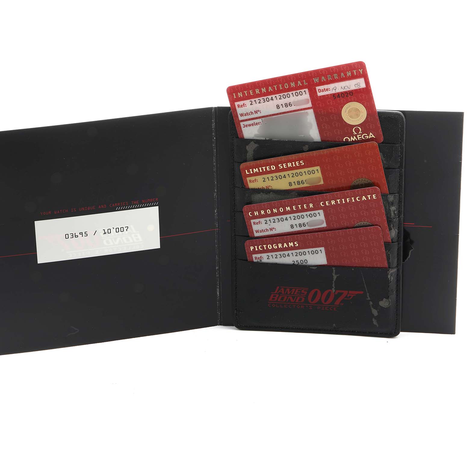The image shows several Omega Seamaster 212.30.41.20.01.001 Men's Stainless Steel Black Dial cards, including warranty and certification, in a James Bond-themed holder.