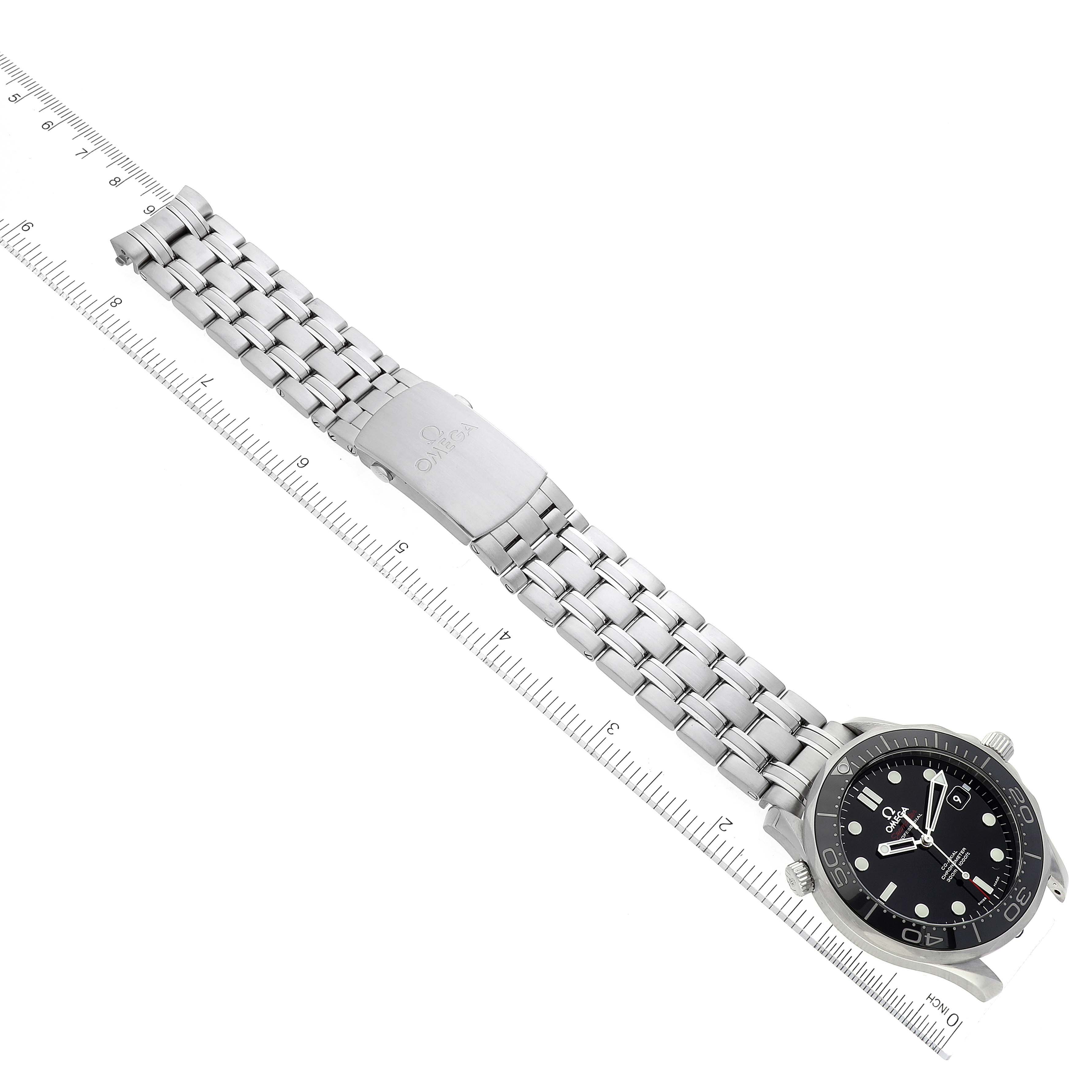 The image shows an Omega Seamaster 212.30.41.20.01.003 Men's Stainless Steel Black Dial 212.30.41.20.01.003 Men's Stainless Steel Black Dial watch displayed at an angle, highlighting its face, bracelet, and clasp with a ruler for scale.
