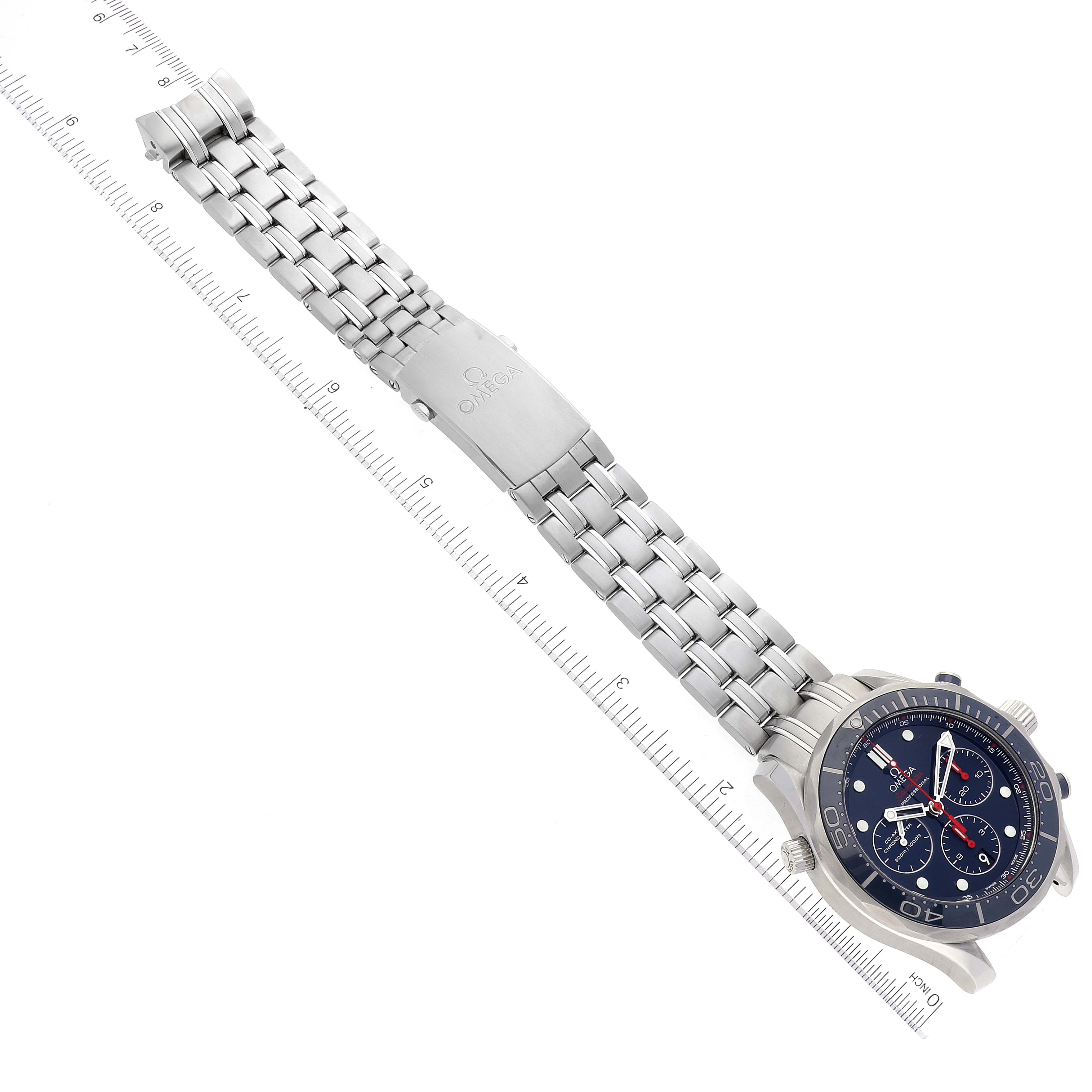 This image shows the front view of the Omega Seamaster 212.30.44.50.03.001 Men's Stainless Steel Blue Dial 212.30.44.50.03.001 Men's Stainless Steel Blue Dial watch, highlighting the metal bracelet and clasp alongside a measuring ruler.