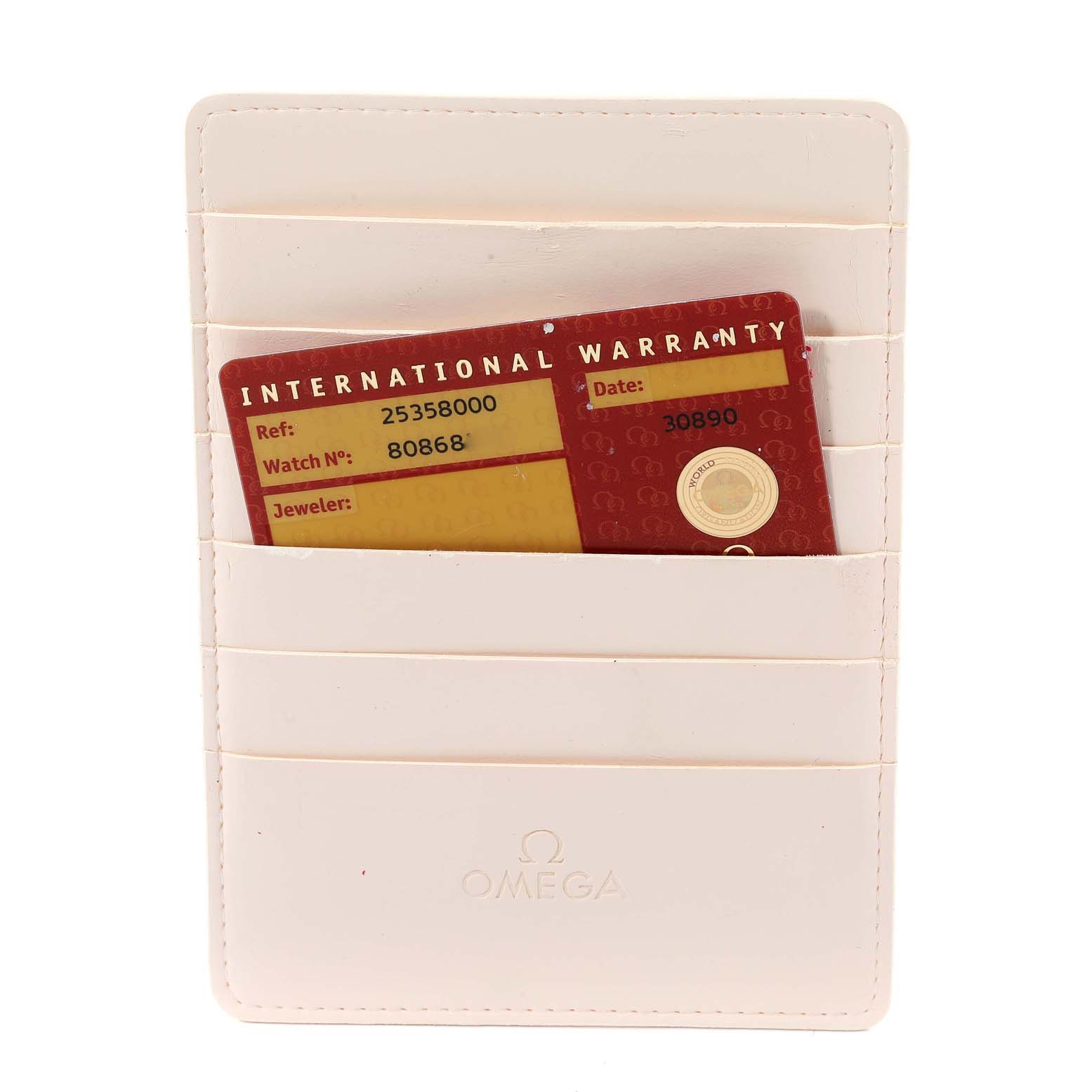 The image shows an Omega Seamaster 2535.80.00 Men's Stainless Steel Blue Dial 2535.80.00 Men's Stainless Steel Blue Dial's international warranty card in a white cardholder.